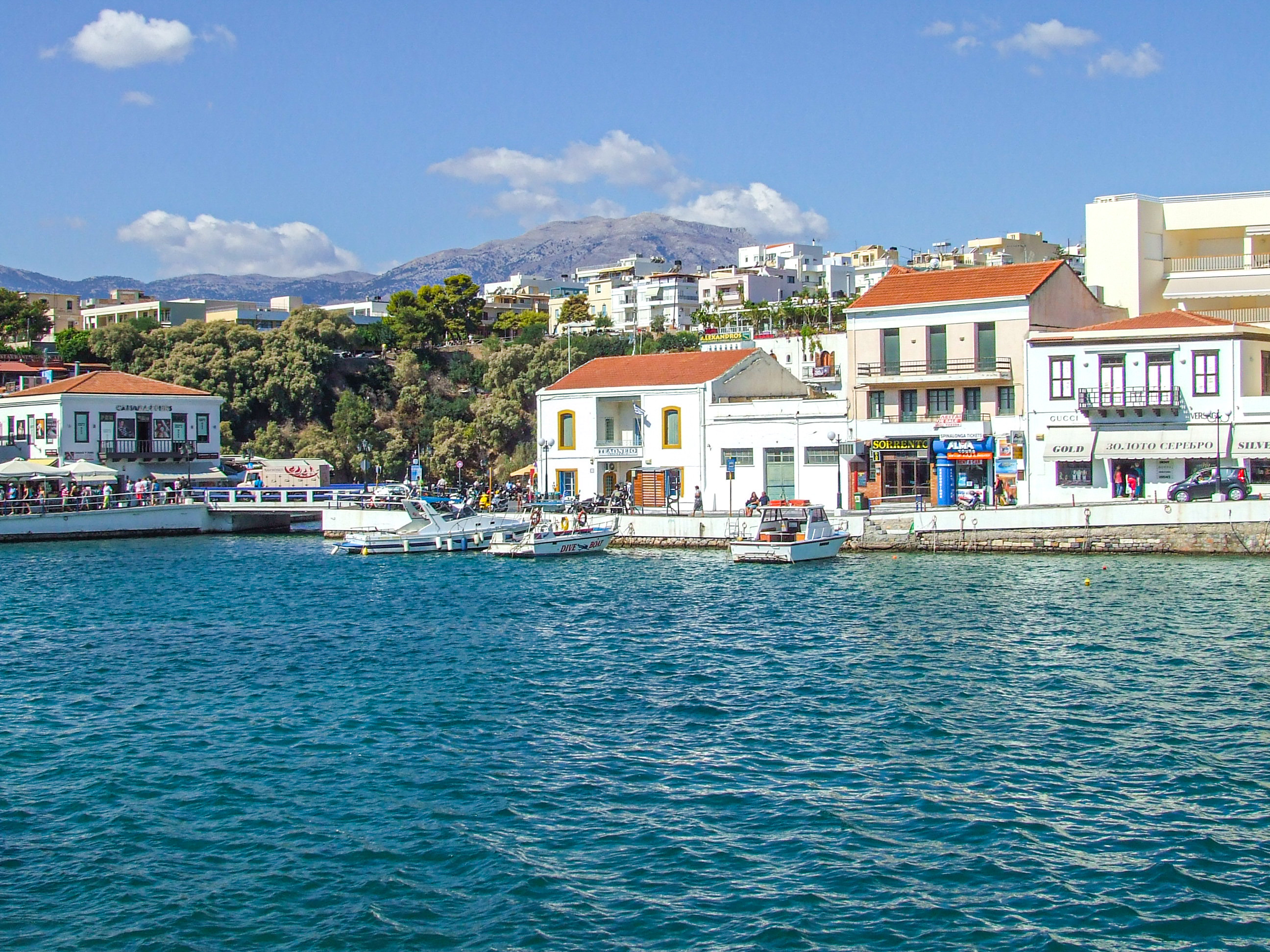 coastal town with a waterfront lined with buildings and shops