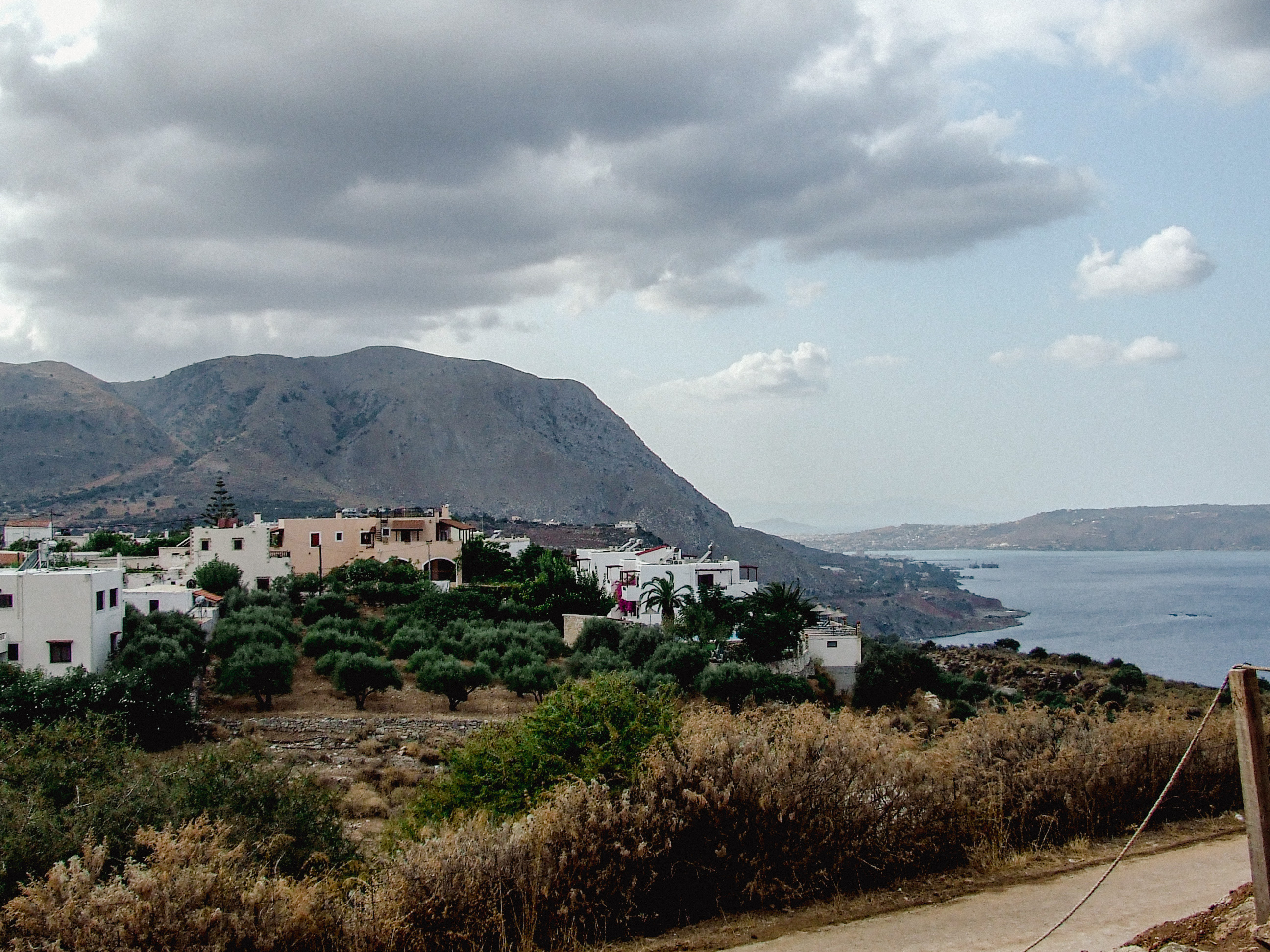 village features white buildings with red roofs.