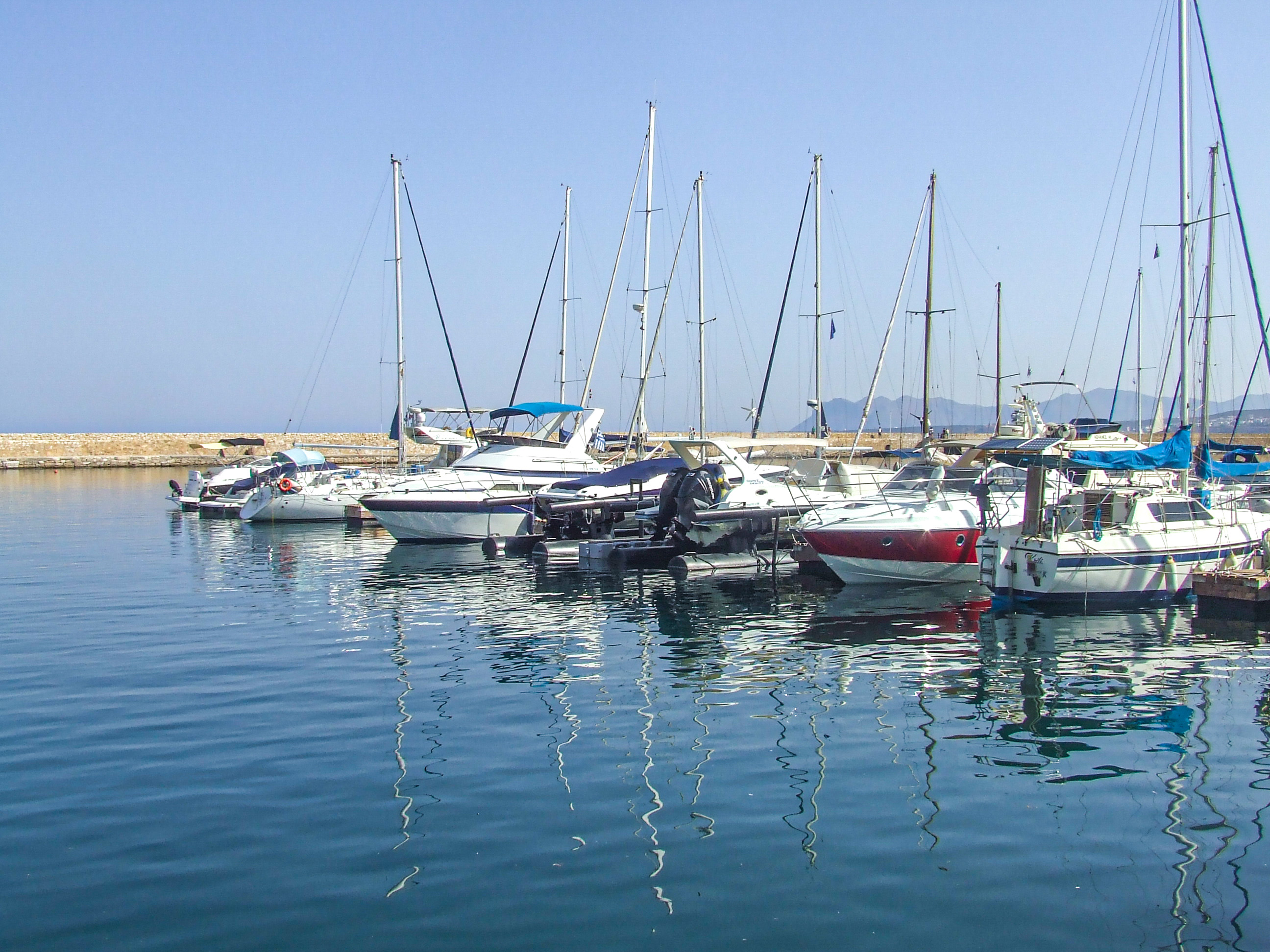 marina with several sailboats and yachts