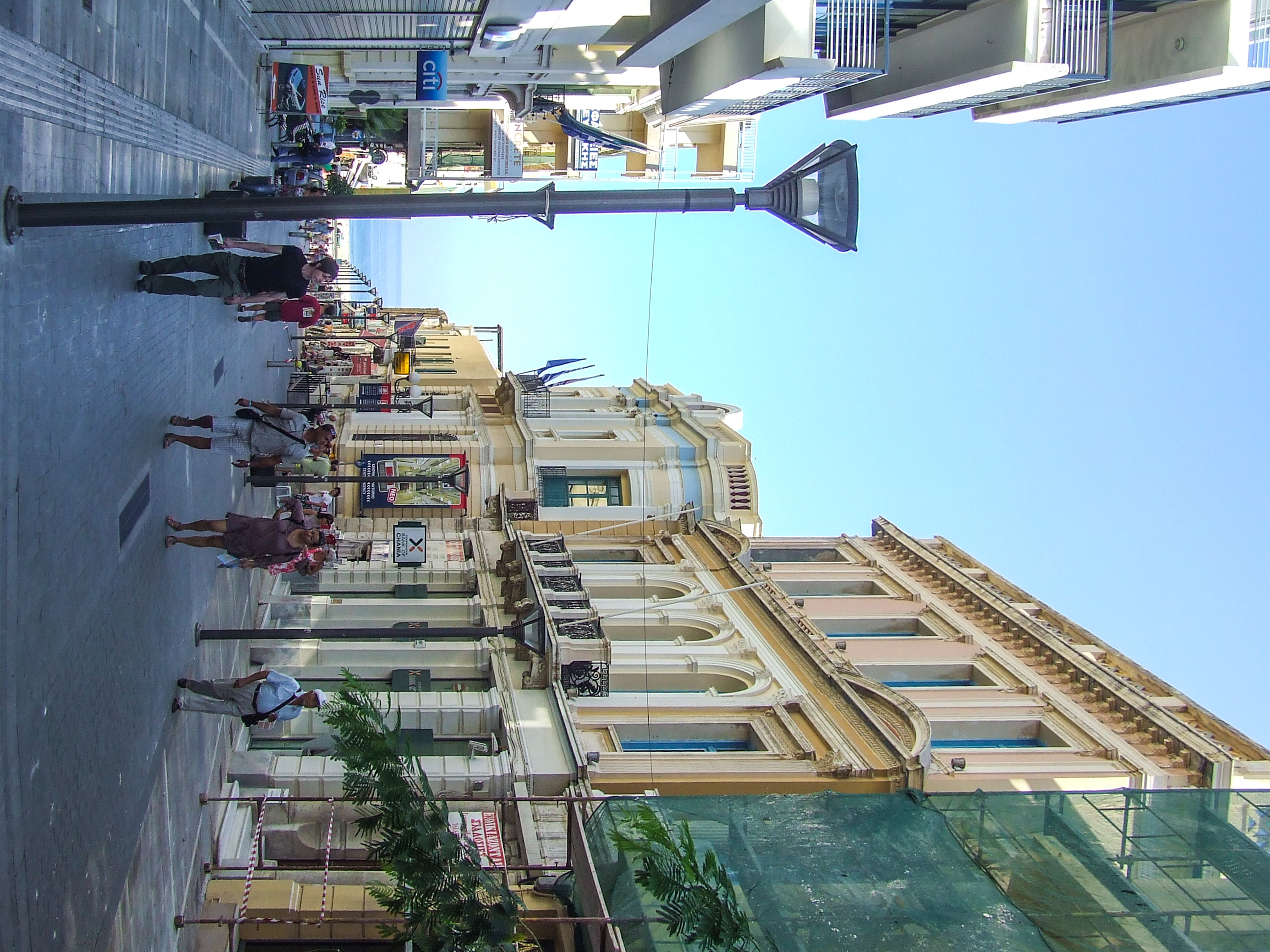 people walking along the sidewalk