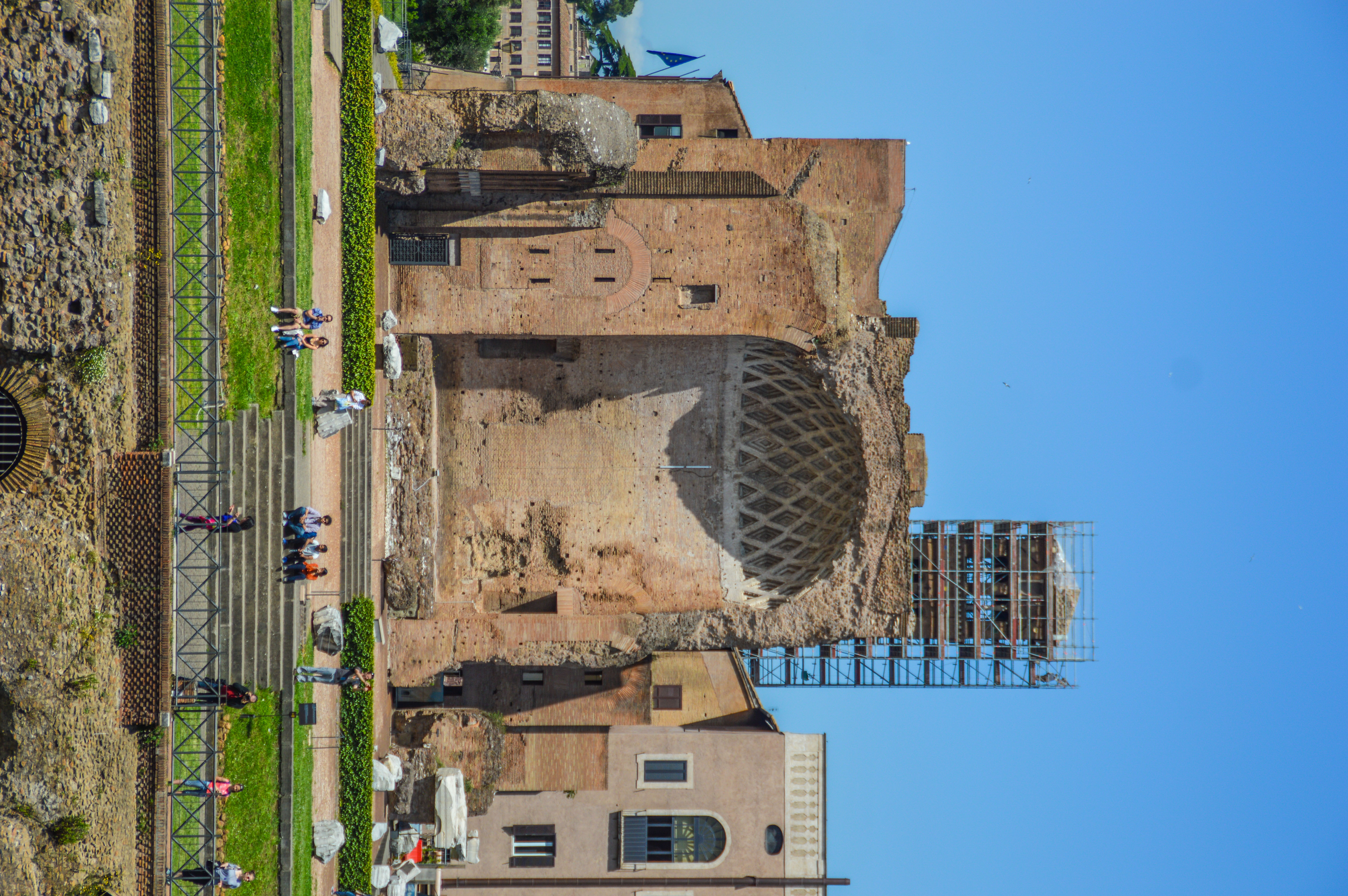 The structure is characterized by its large, oval amphitheater shape and partially ruined state. 