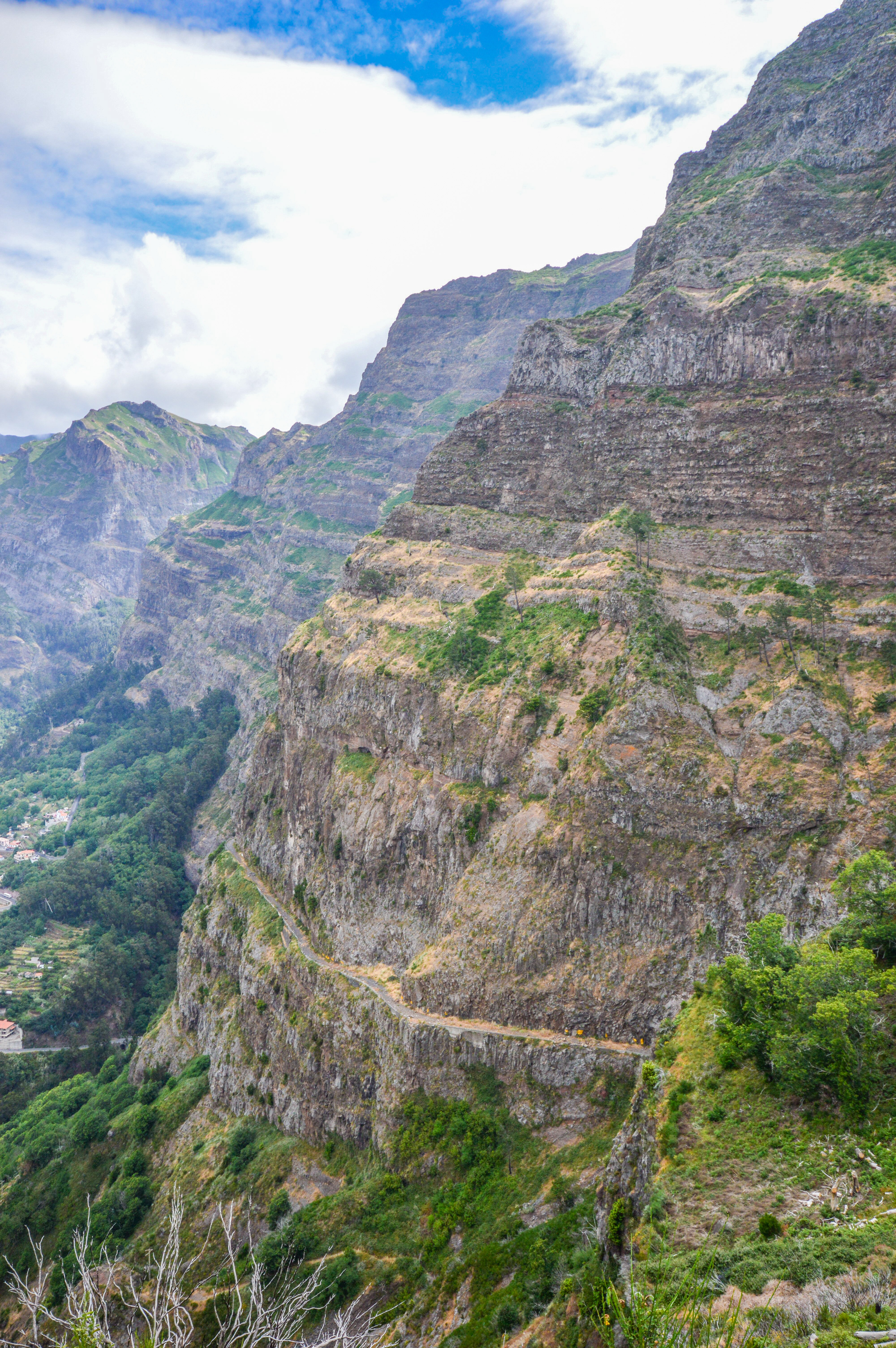 mountainous landscape with steep cliffs and terraced fields