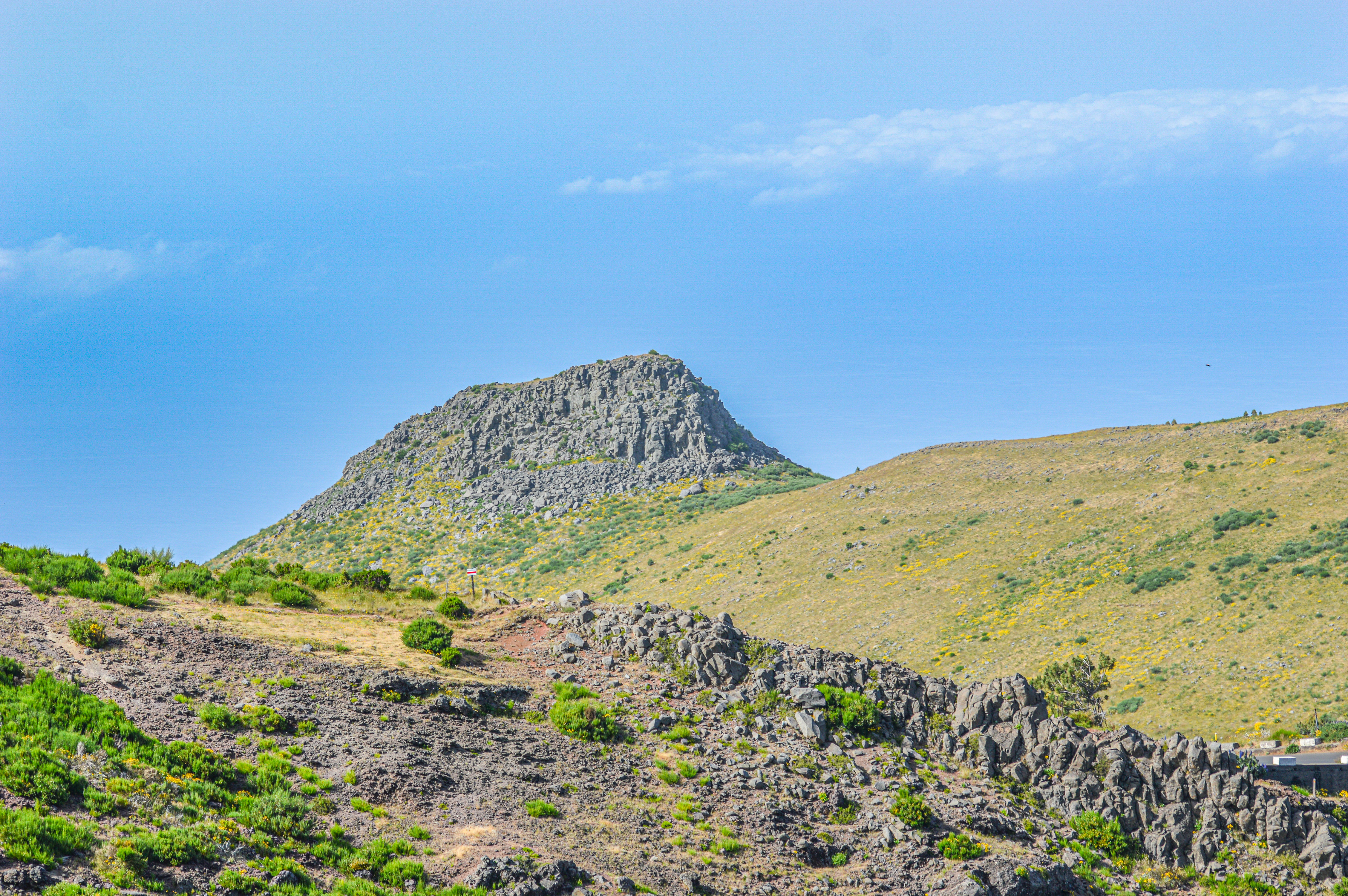 The hill features a prominent rocky outcrop near the top