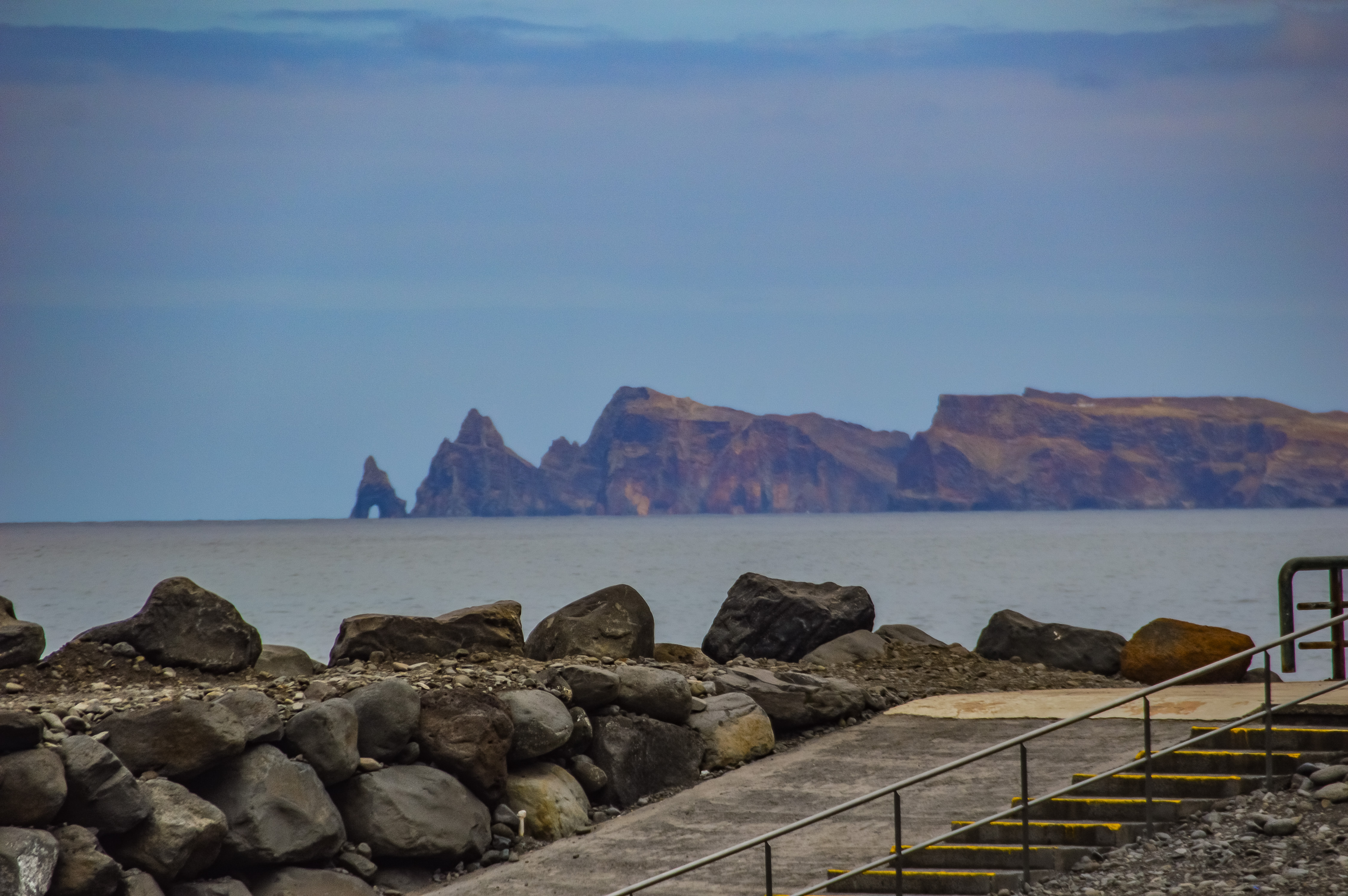 stairs and railings leading down to the water's edge