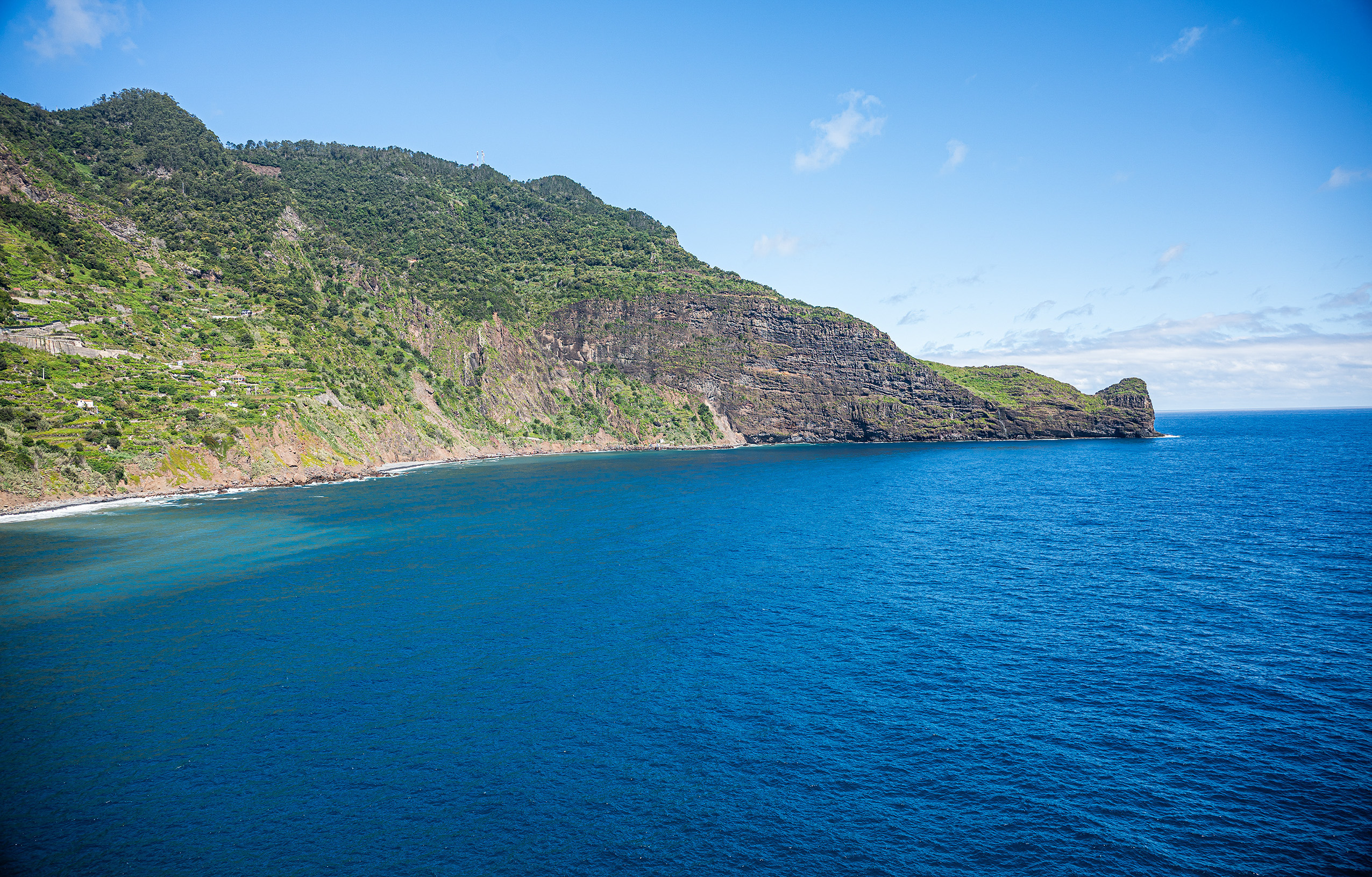coastal landscape with a steep, rocky cliff
