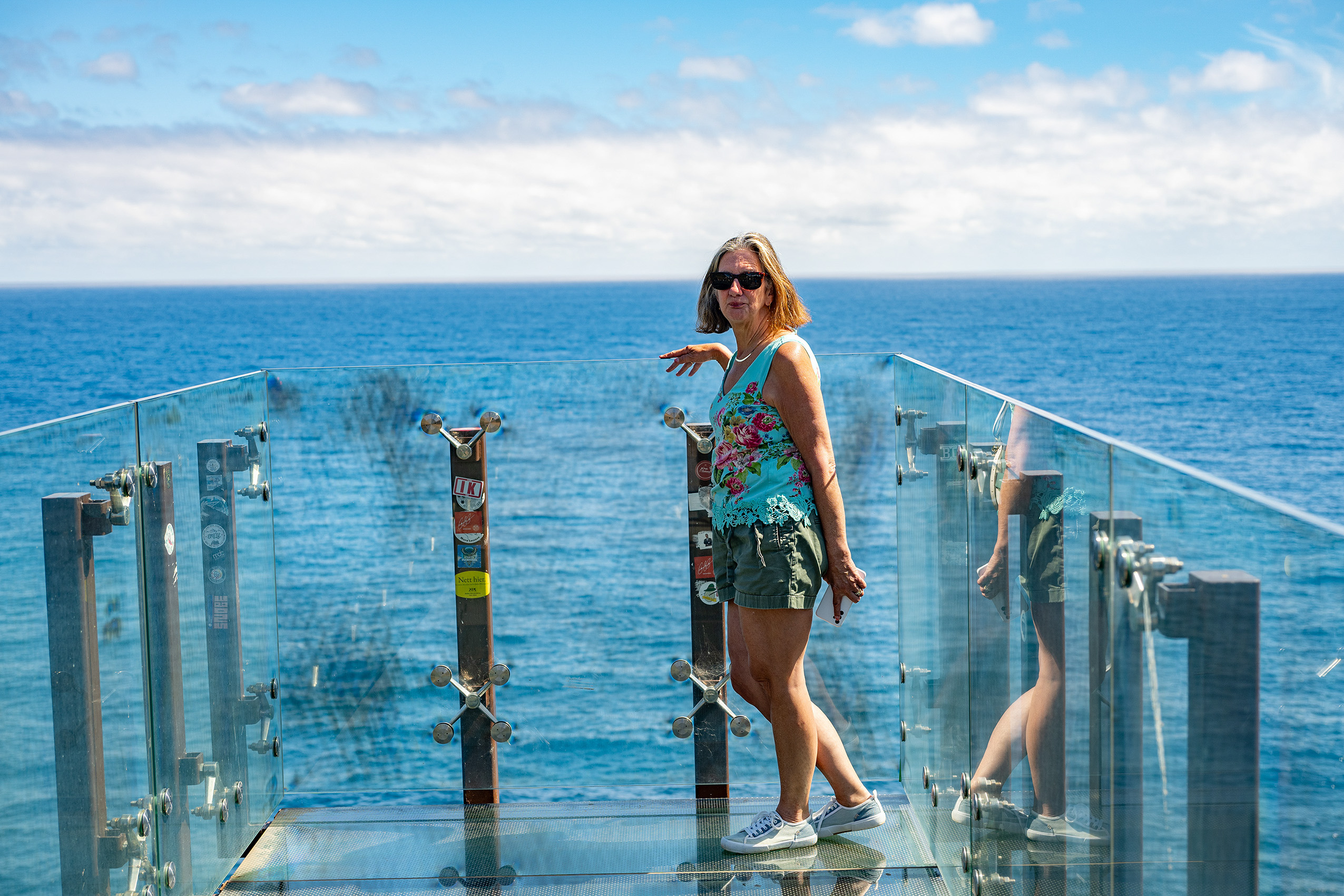 glass-bottomed observation platform extending over the ocean