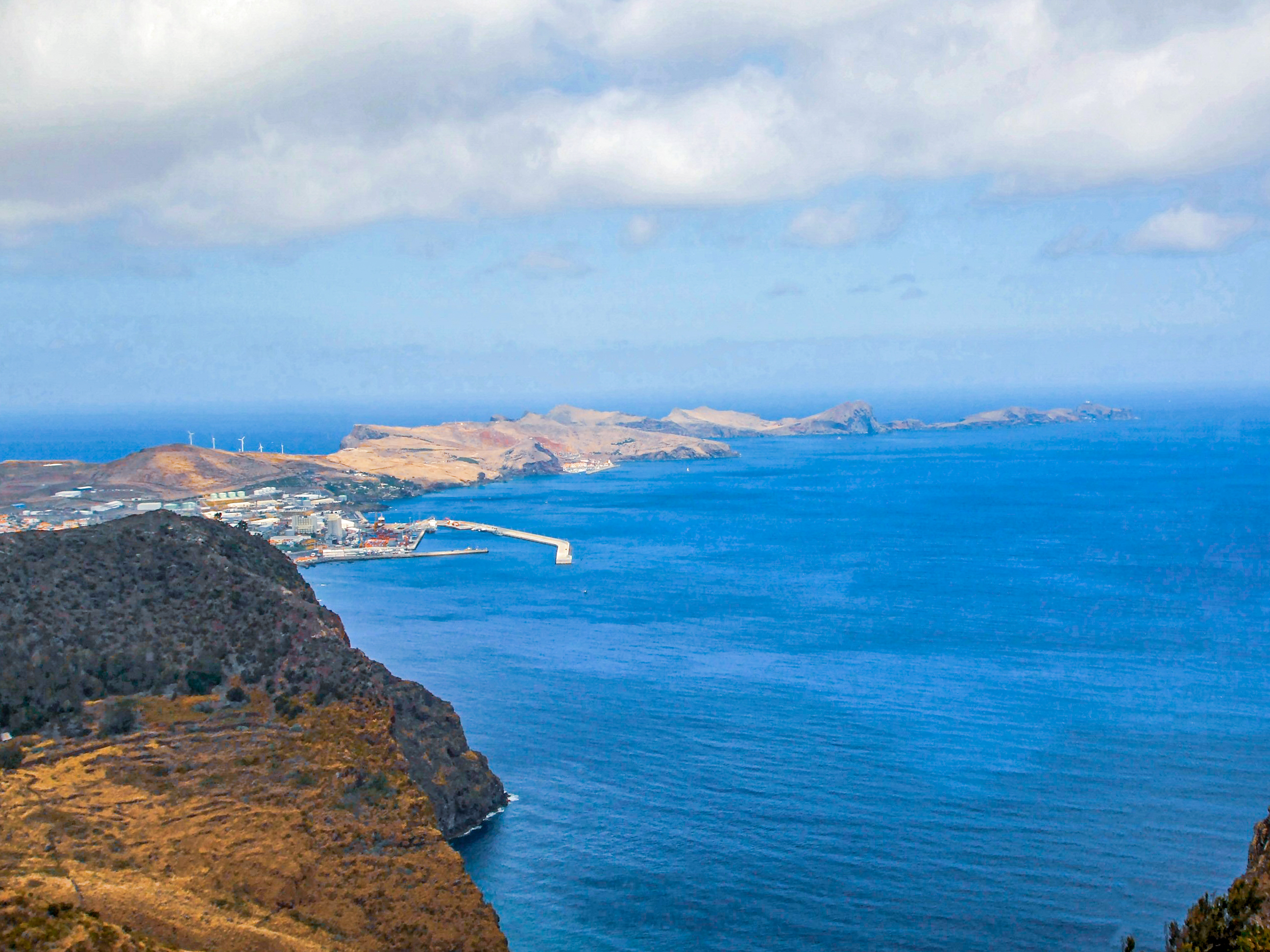 a port, and a breakwater extending into the sea