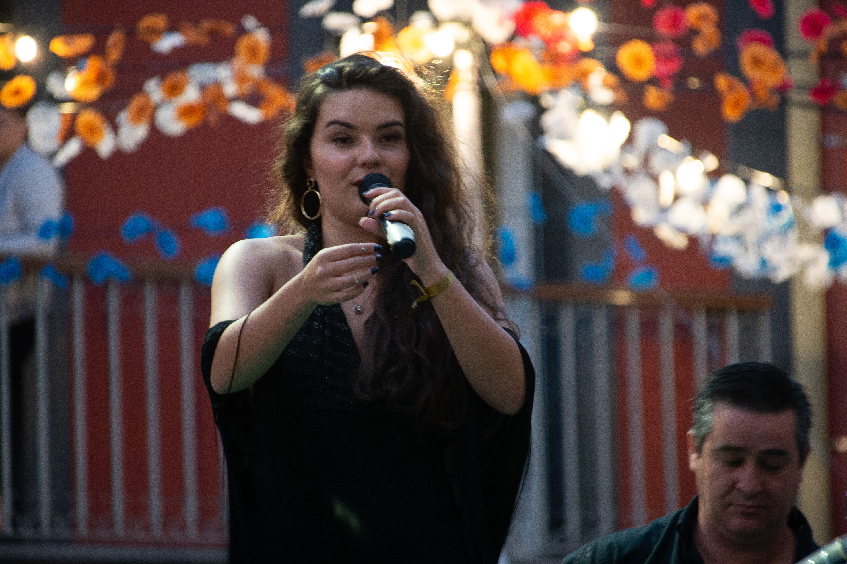a woman singing into a microphone