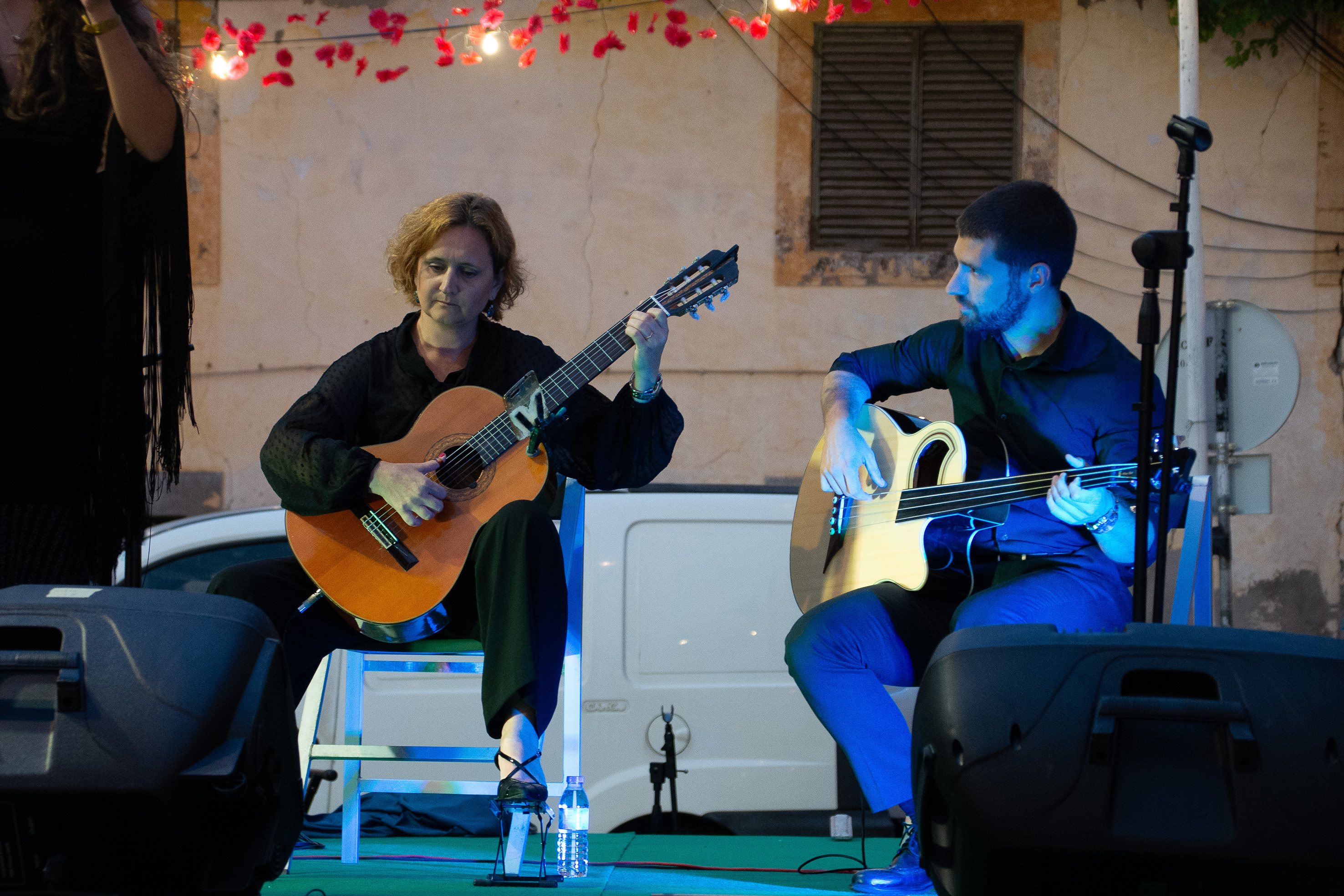 two musicians performing on stage