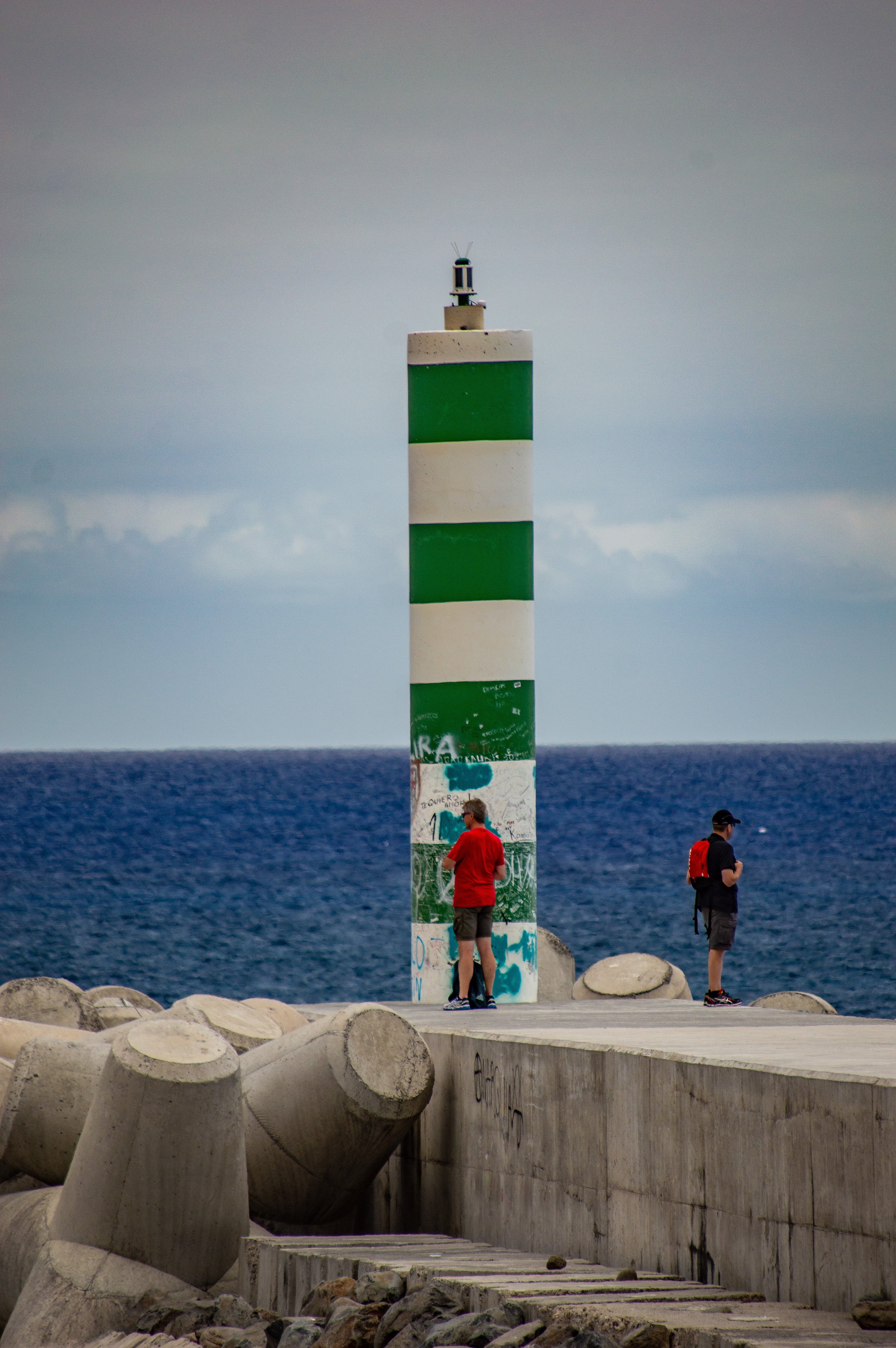 lighthouse with green and white horizontal stripes