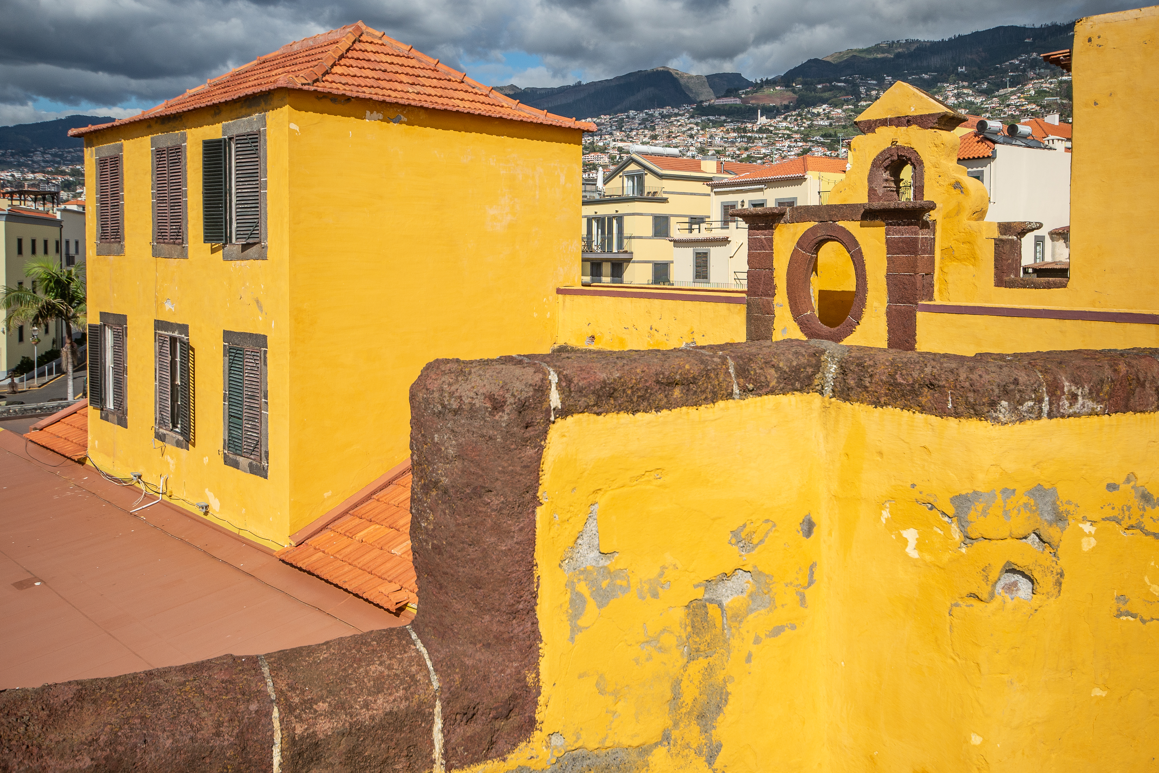 yellow building with a red-tiled roof