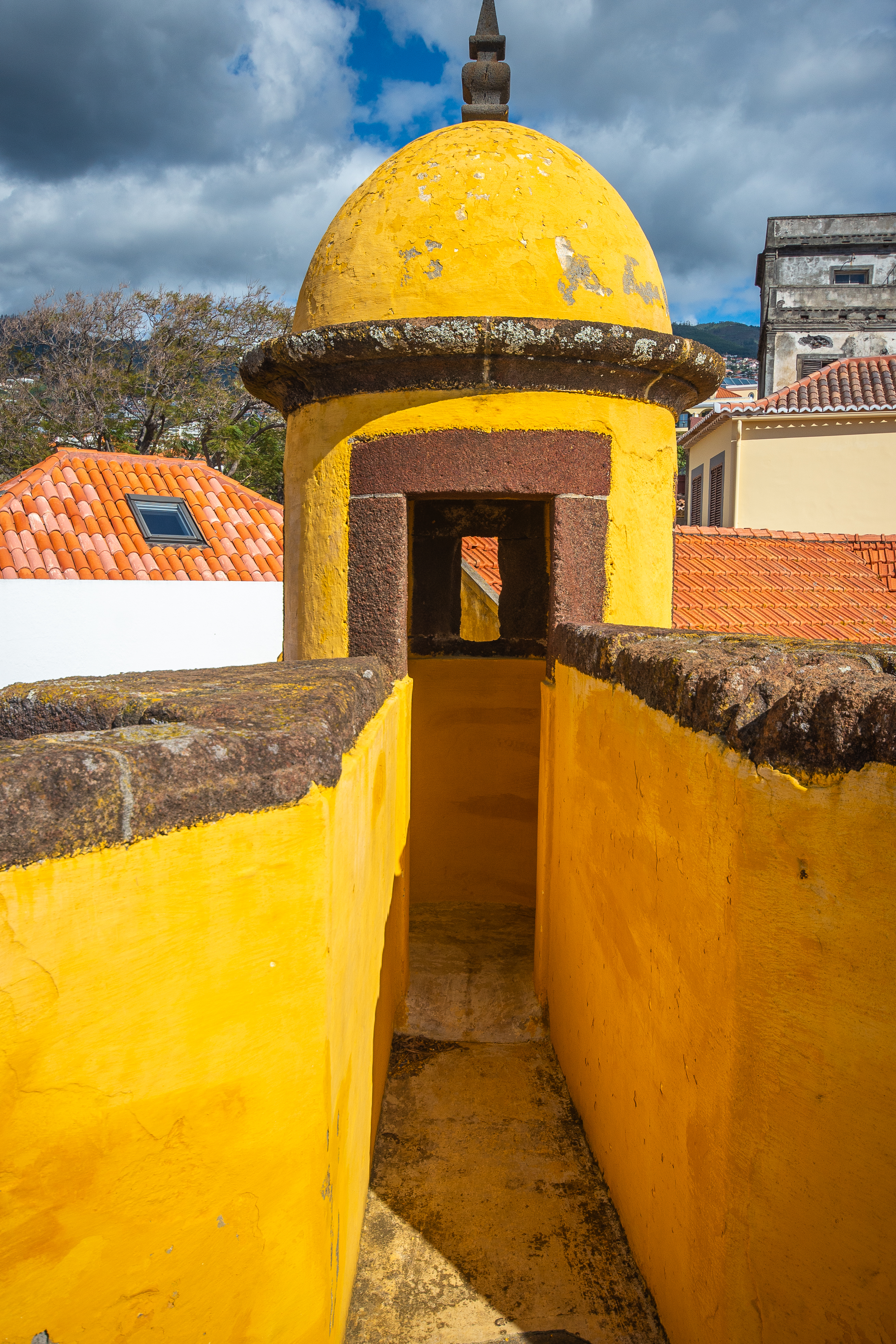 yellow structure with a dome and an archway
