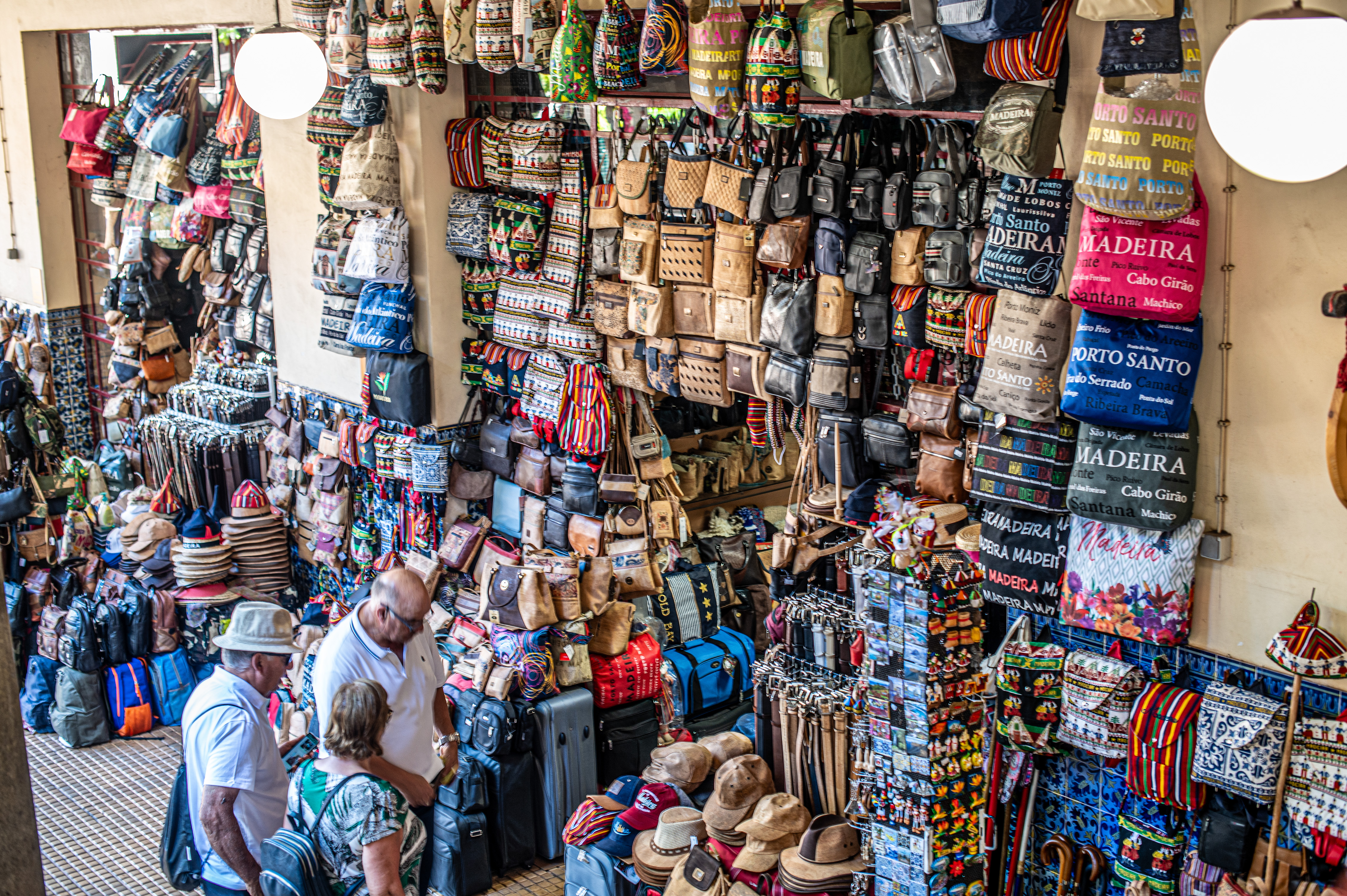 leather goods, including bags, wallets, belts, and hats