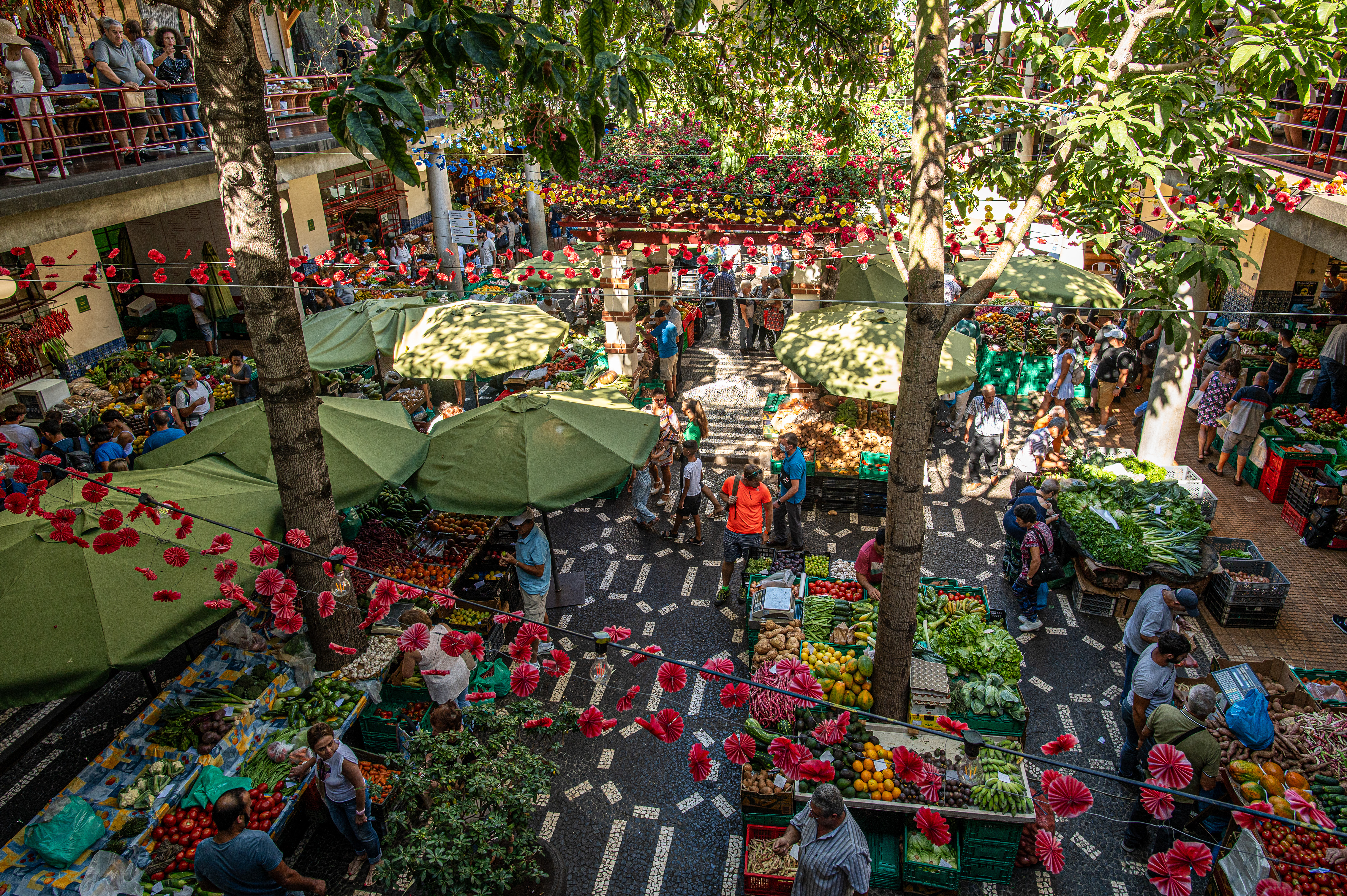 The market is adorned with colorful decorations