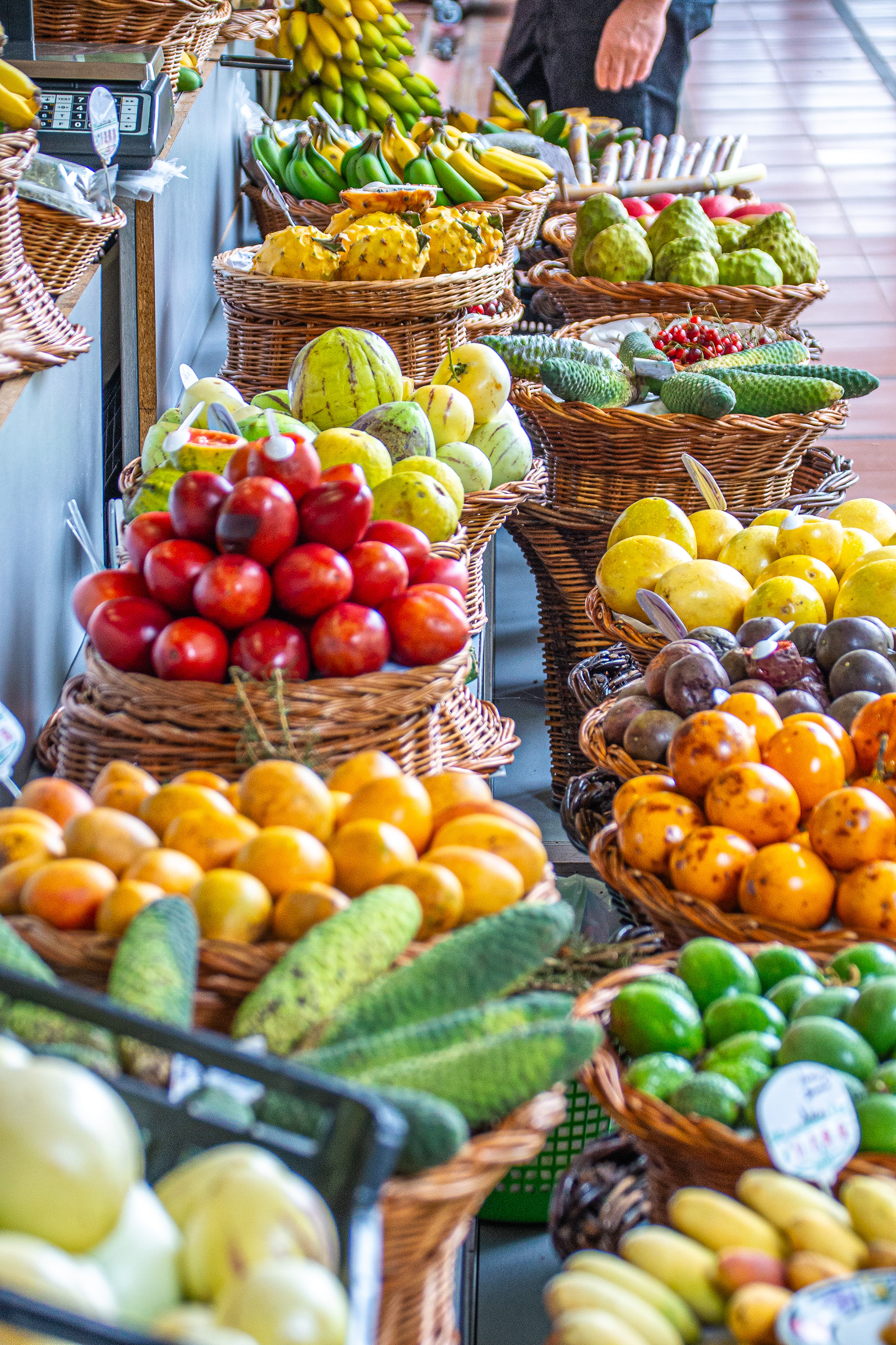 produce includes bananas, papayas, guavas, tomatoes, passion fruits, avocados, oranges, and other tropical fruits