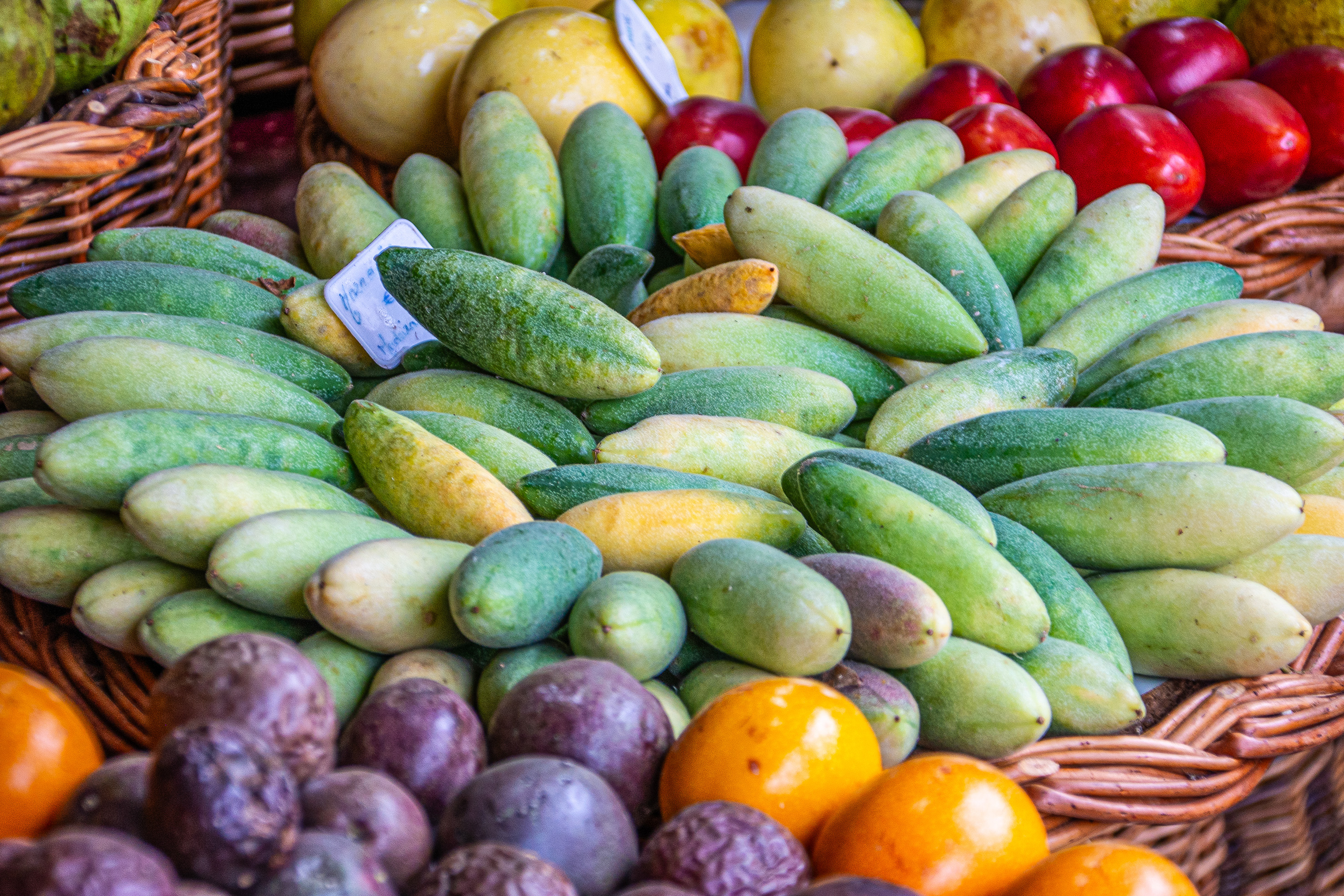 fresh fruits and vegetables arranged in wicker baskets