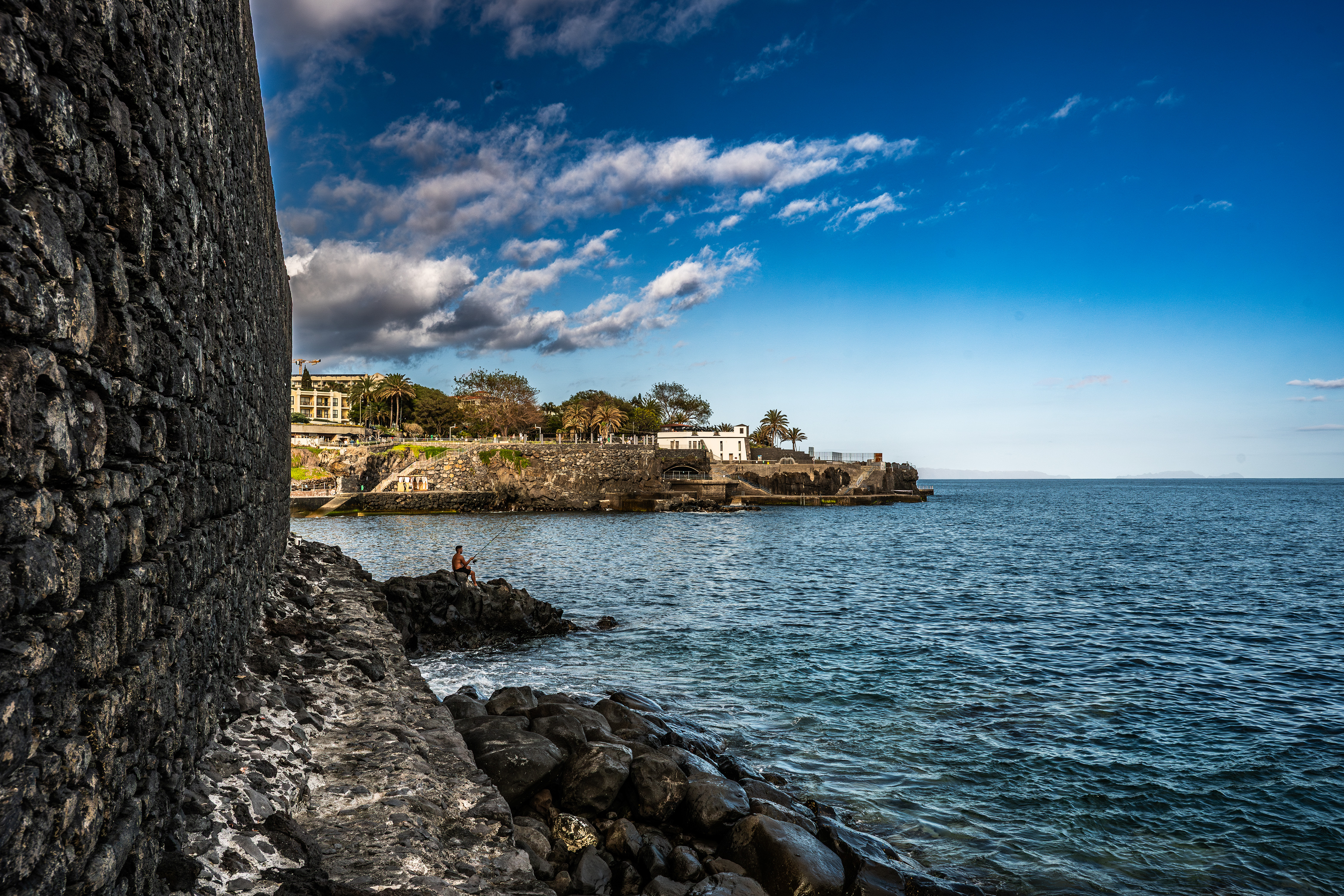 fishing on a rocky outcrop