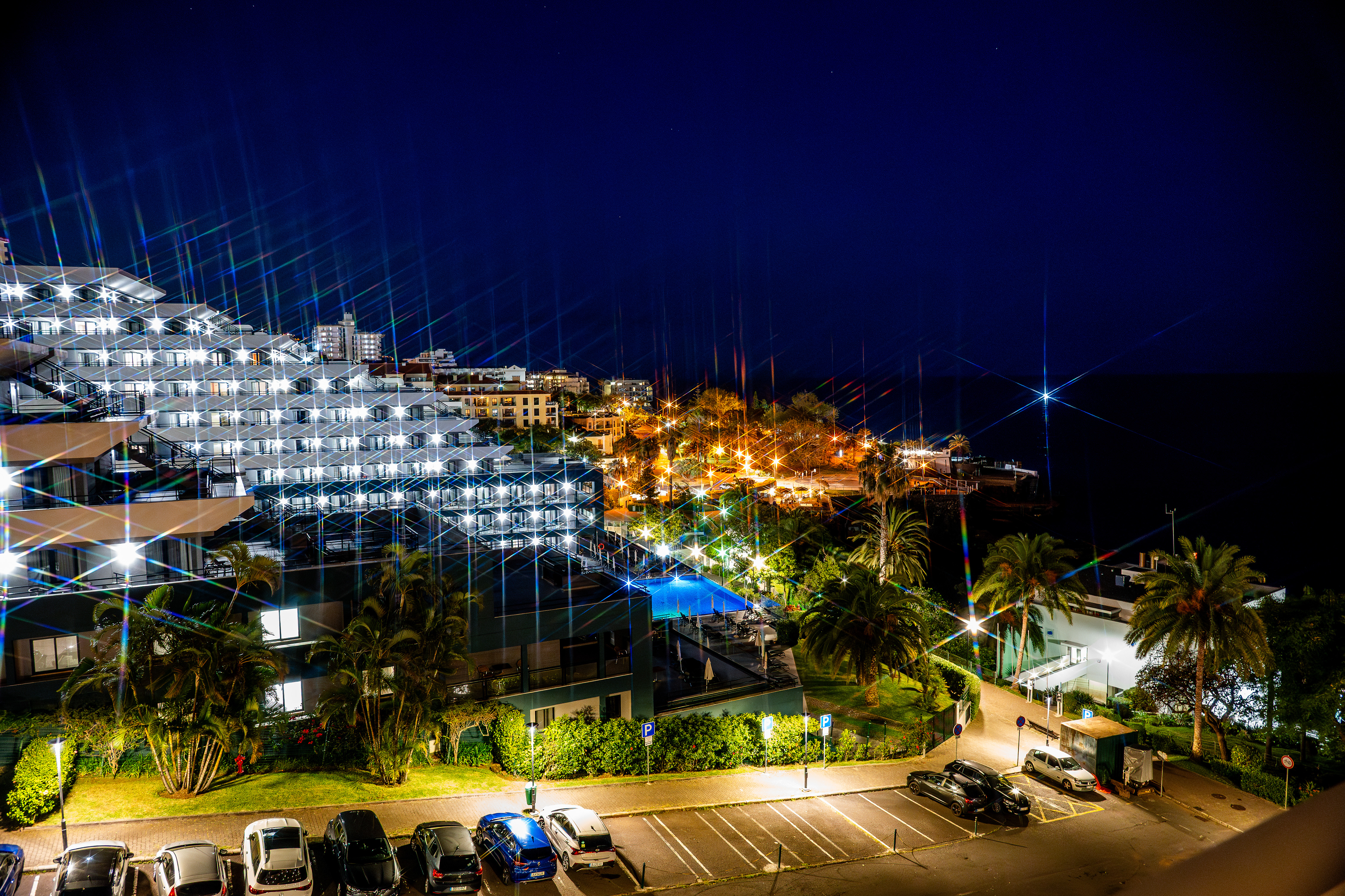 light beams are projected across the building