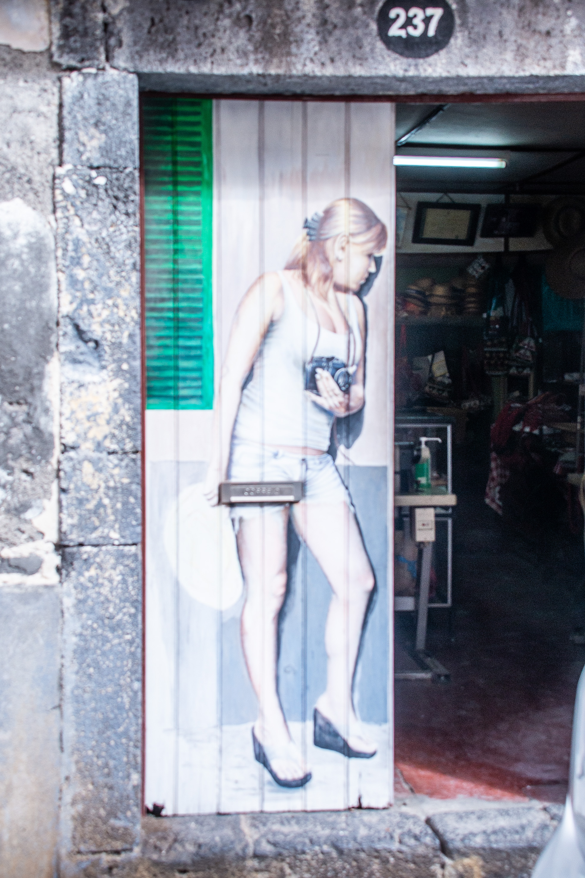 a woman walking past a doorway