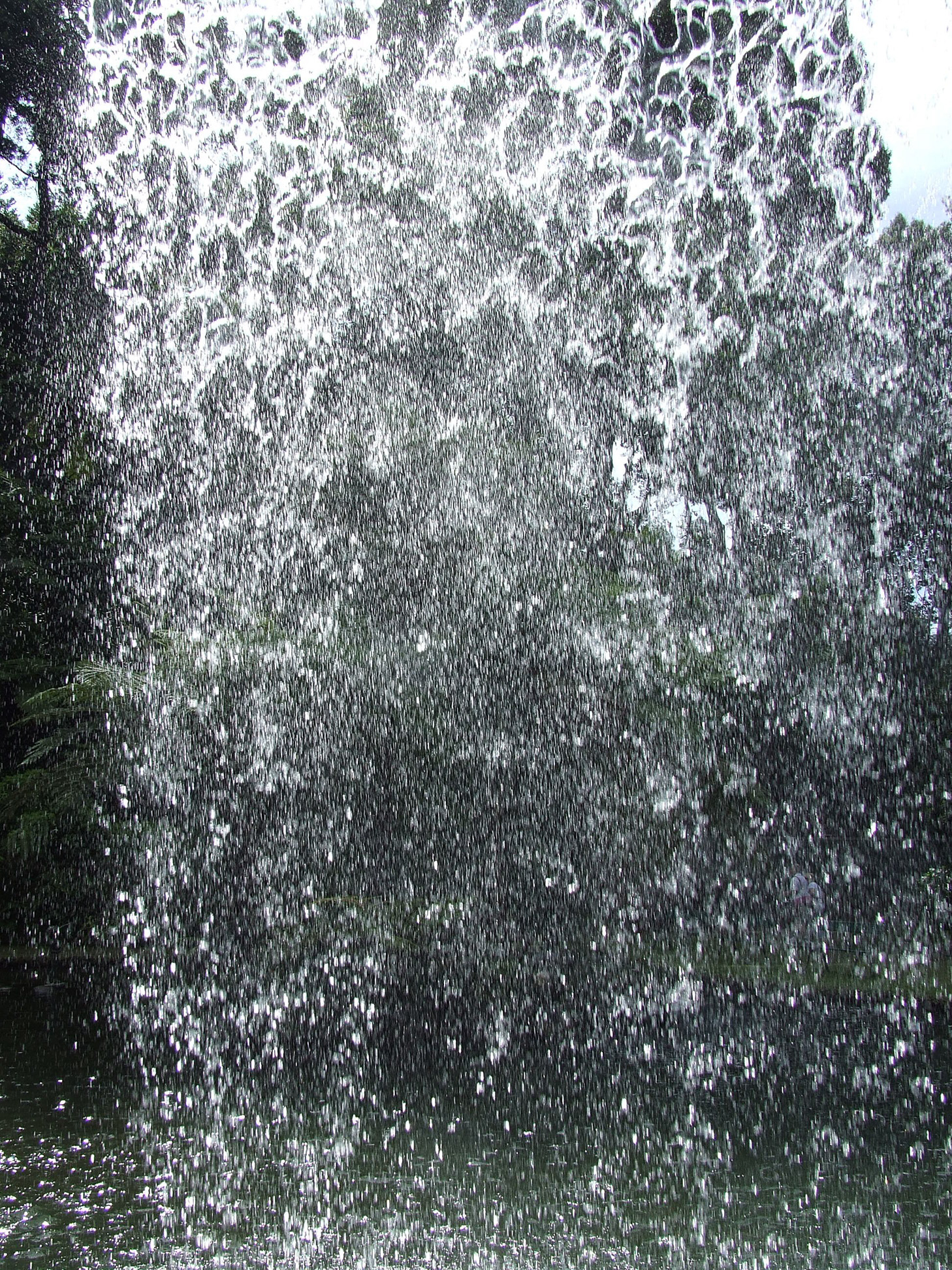 behind the waterfall