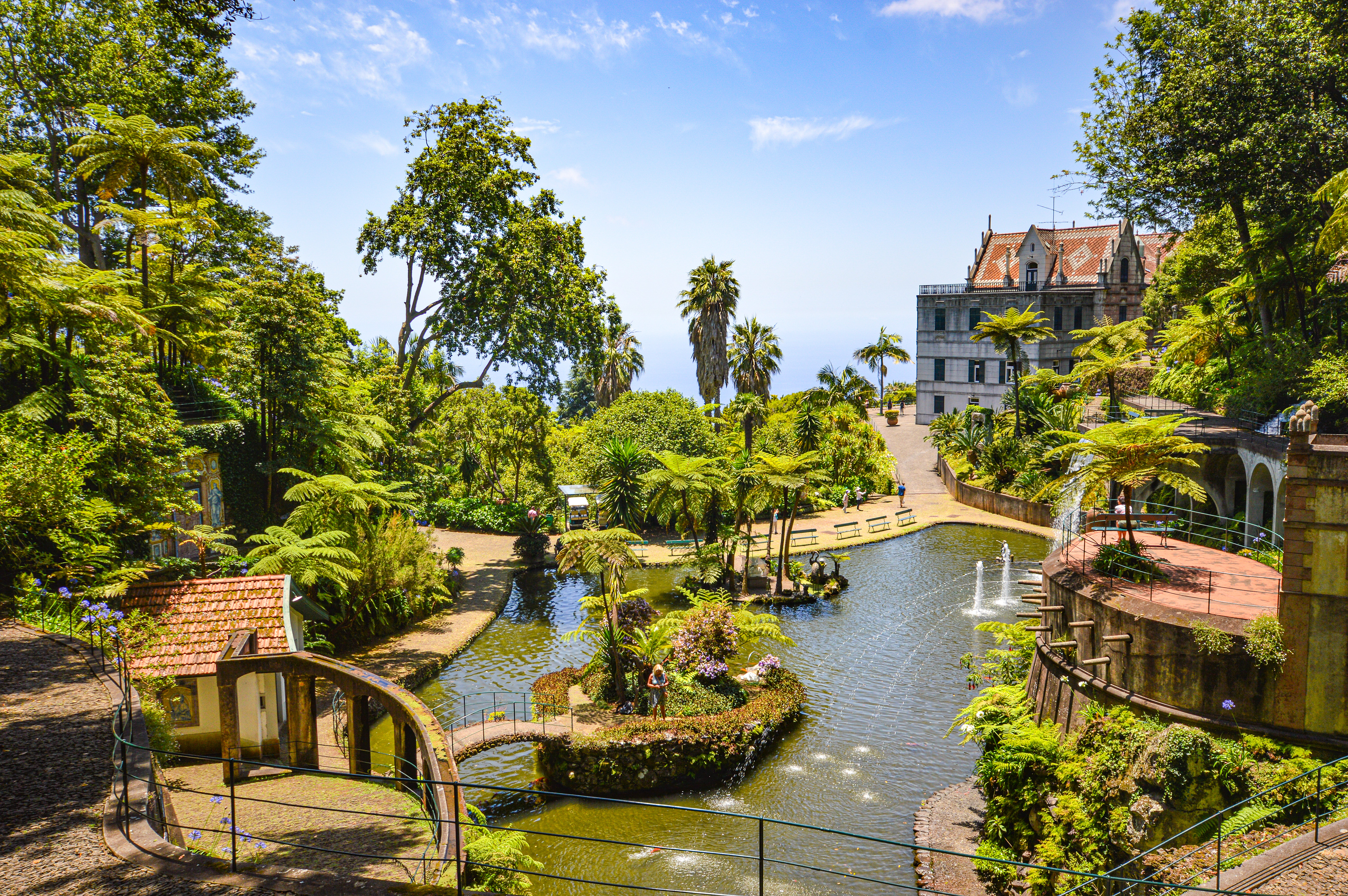 lush, well-maintained garden with a central water feature
