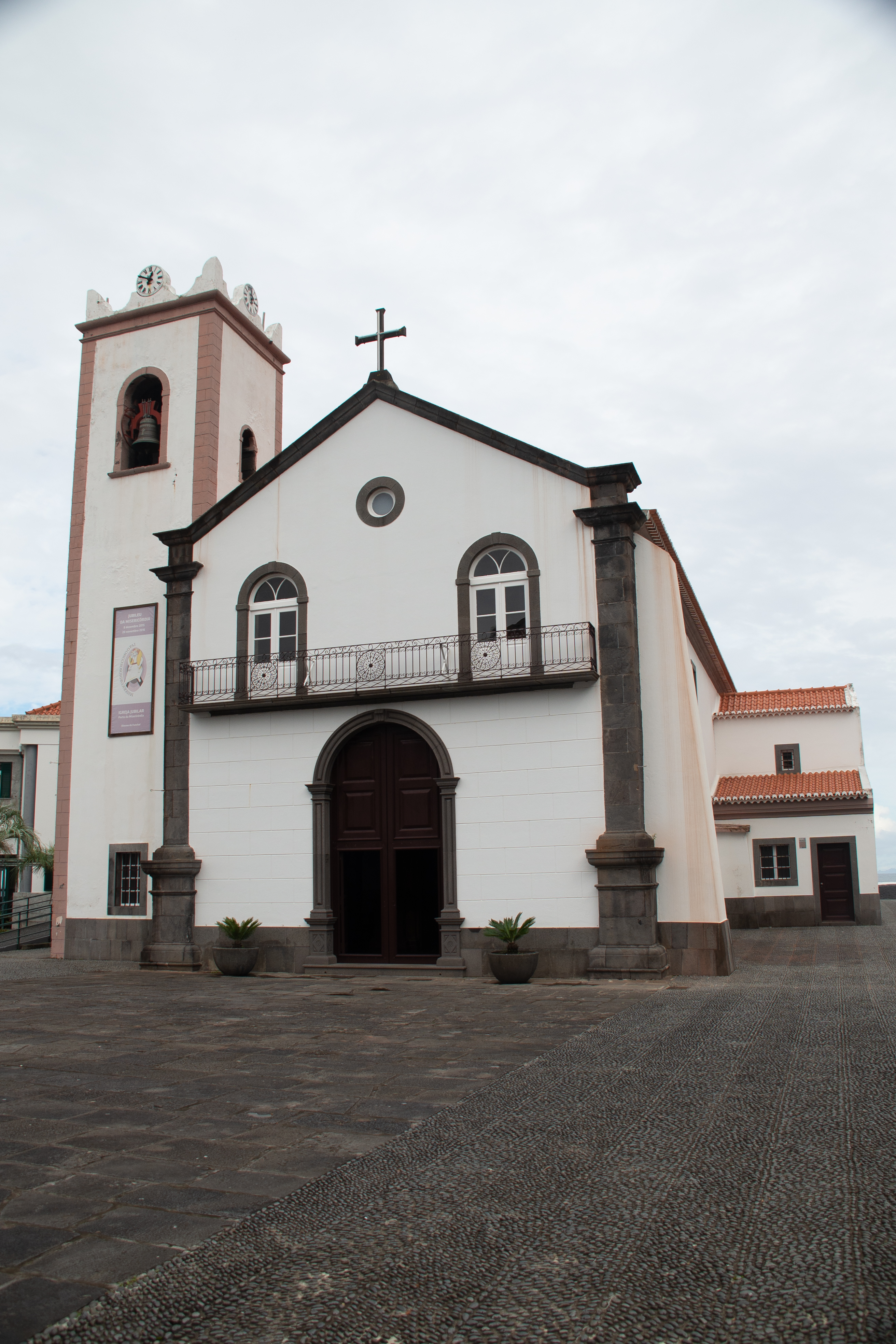 a church with a white facade