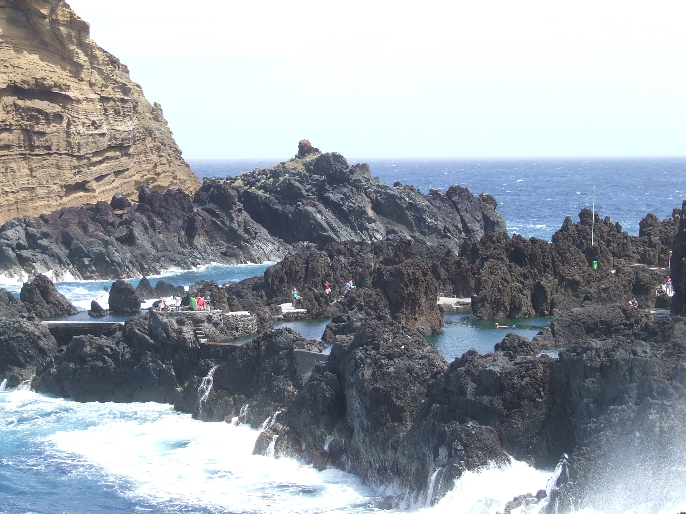 People are seen exploring and swimming in the area