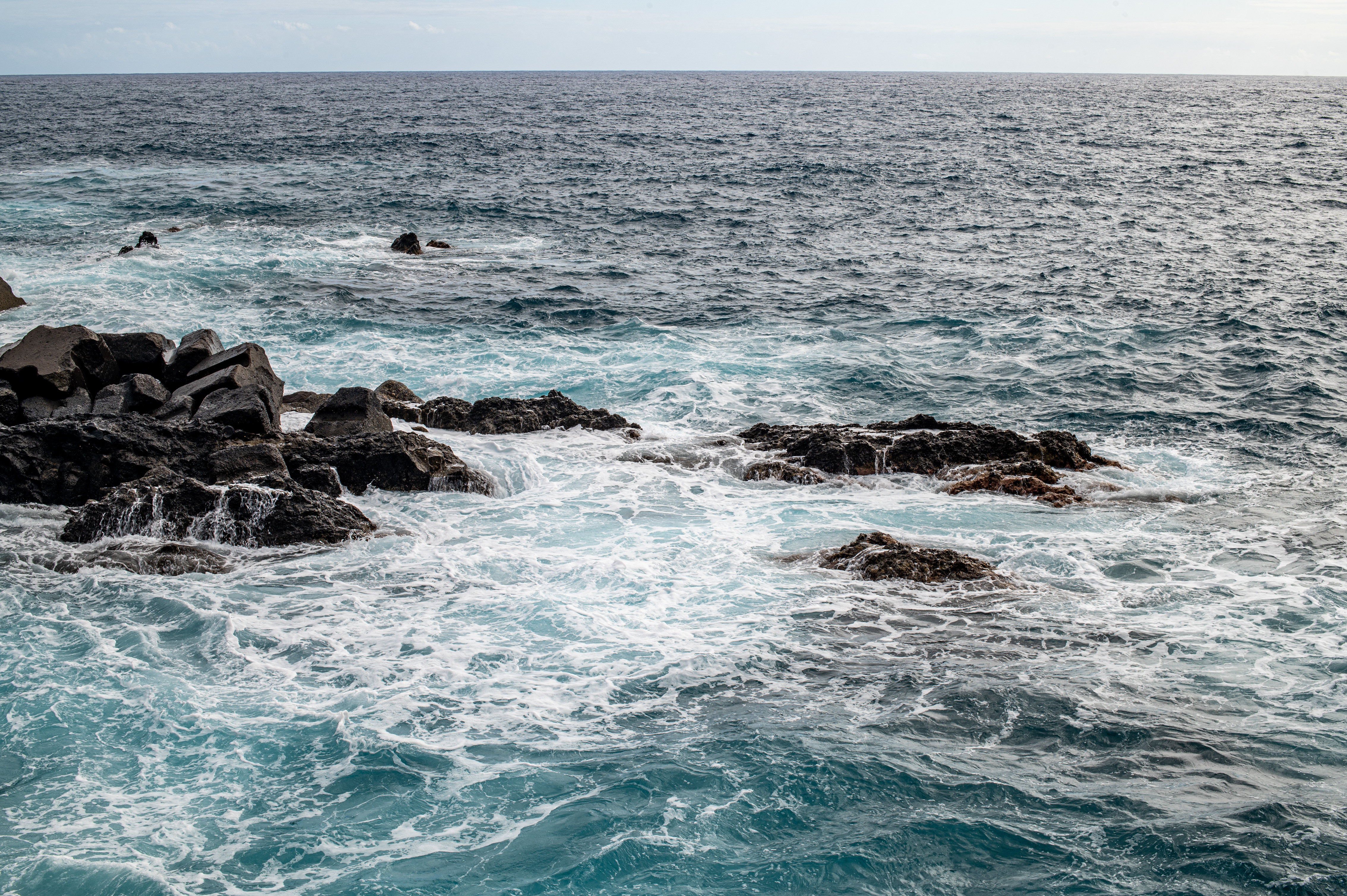 waves crashing against the rocks