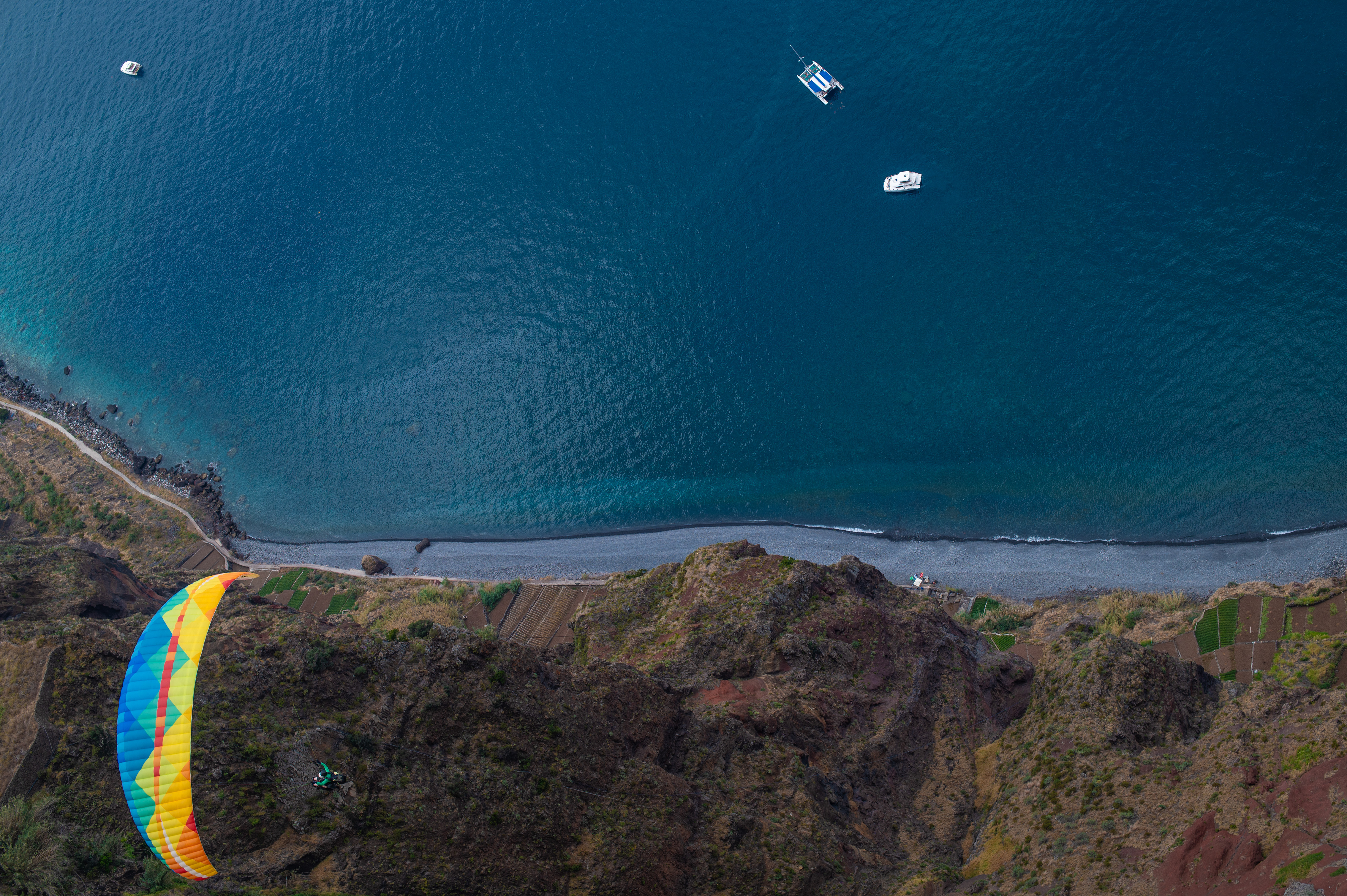 Three Boats And A Paraglider