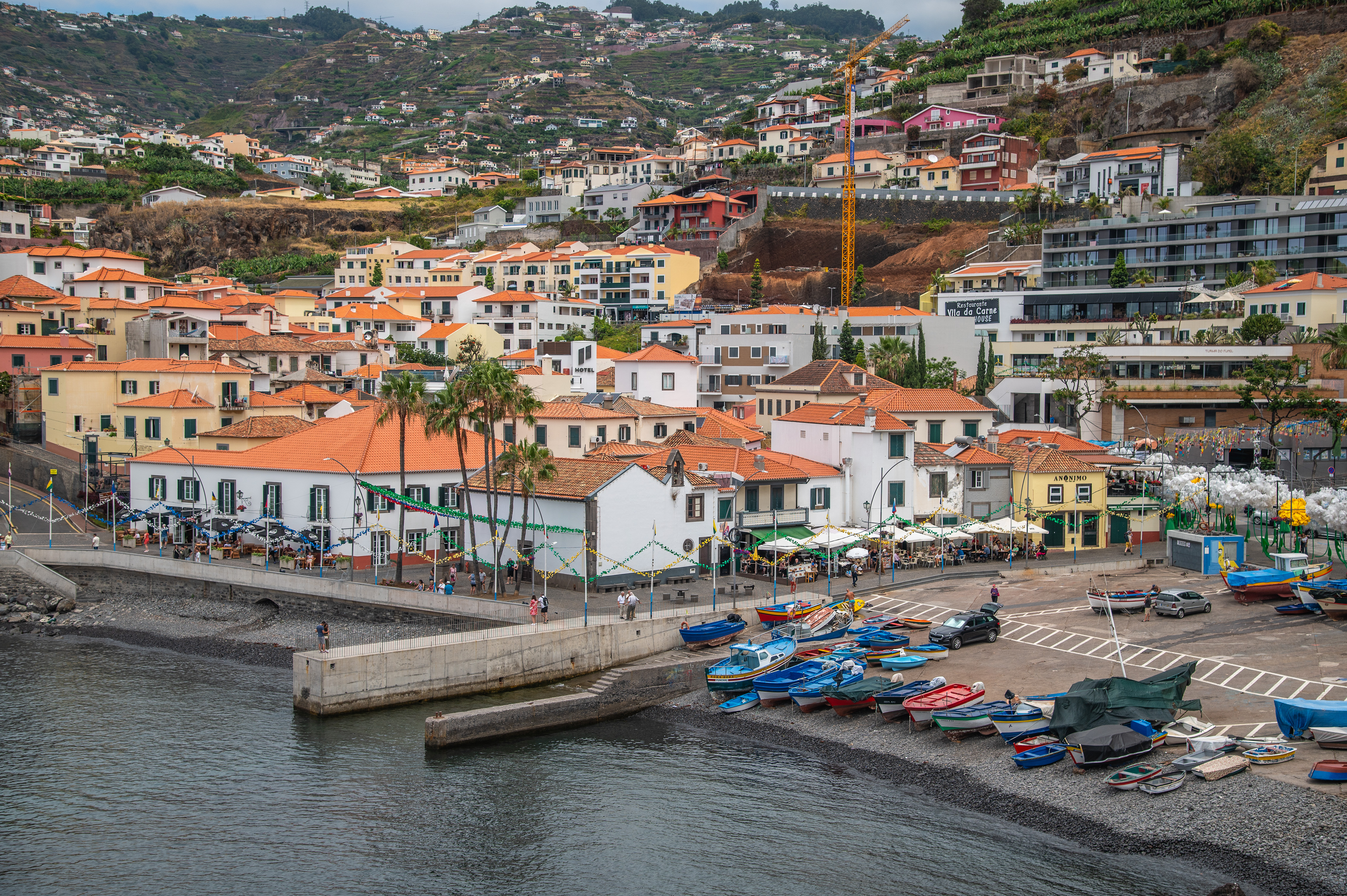 The waterfront area includes a promenade lined with cafes and restaurants