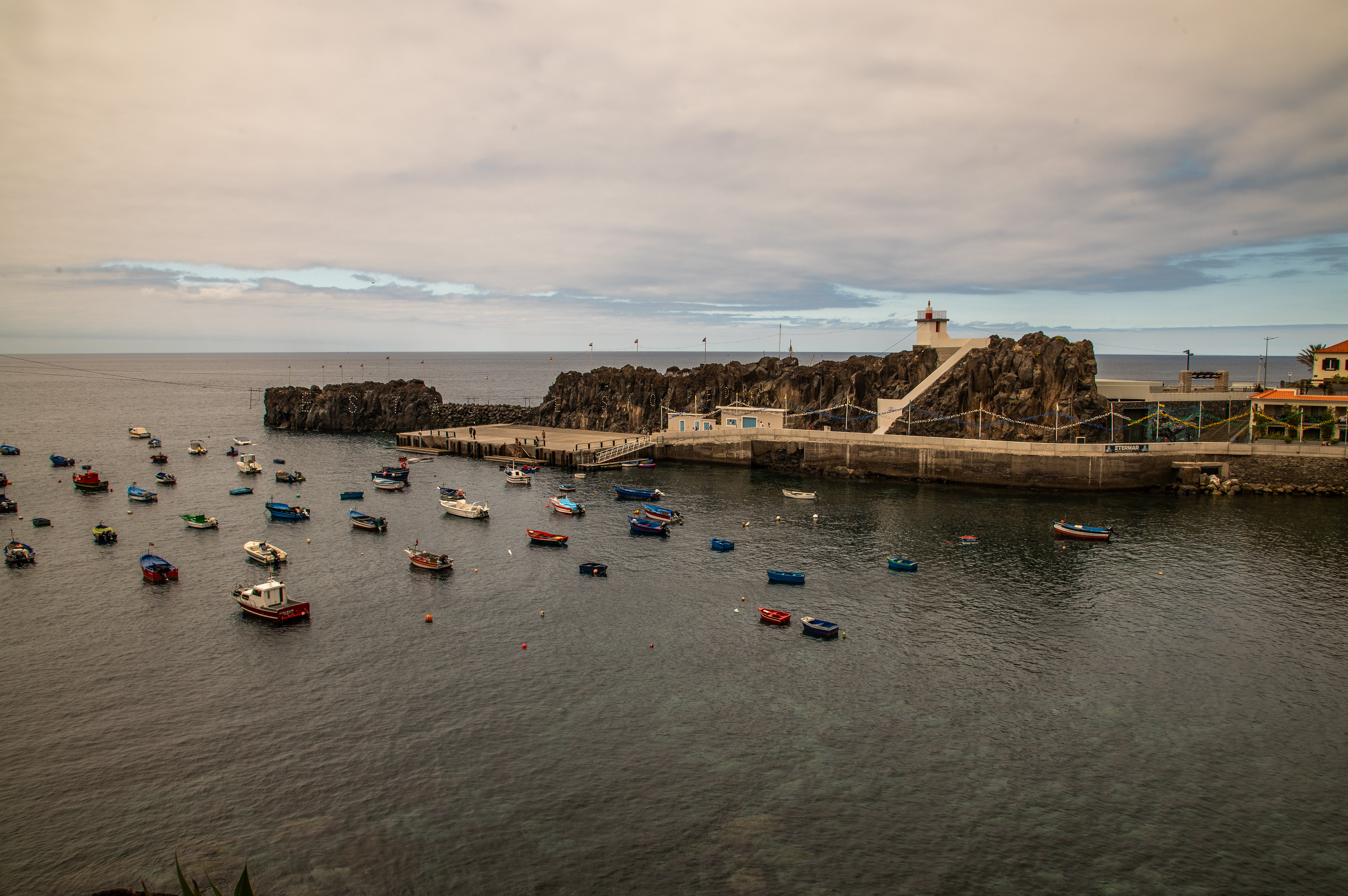 numerous small boats floating on calm waters