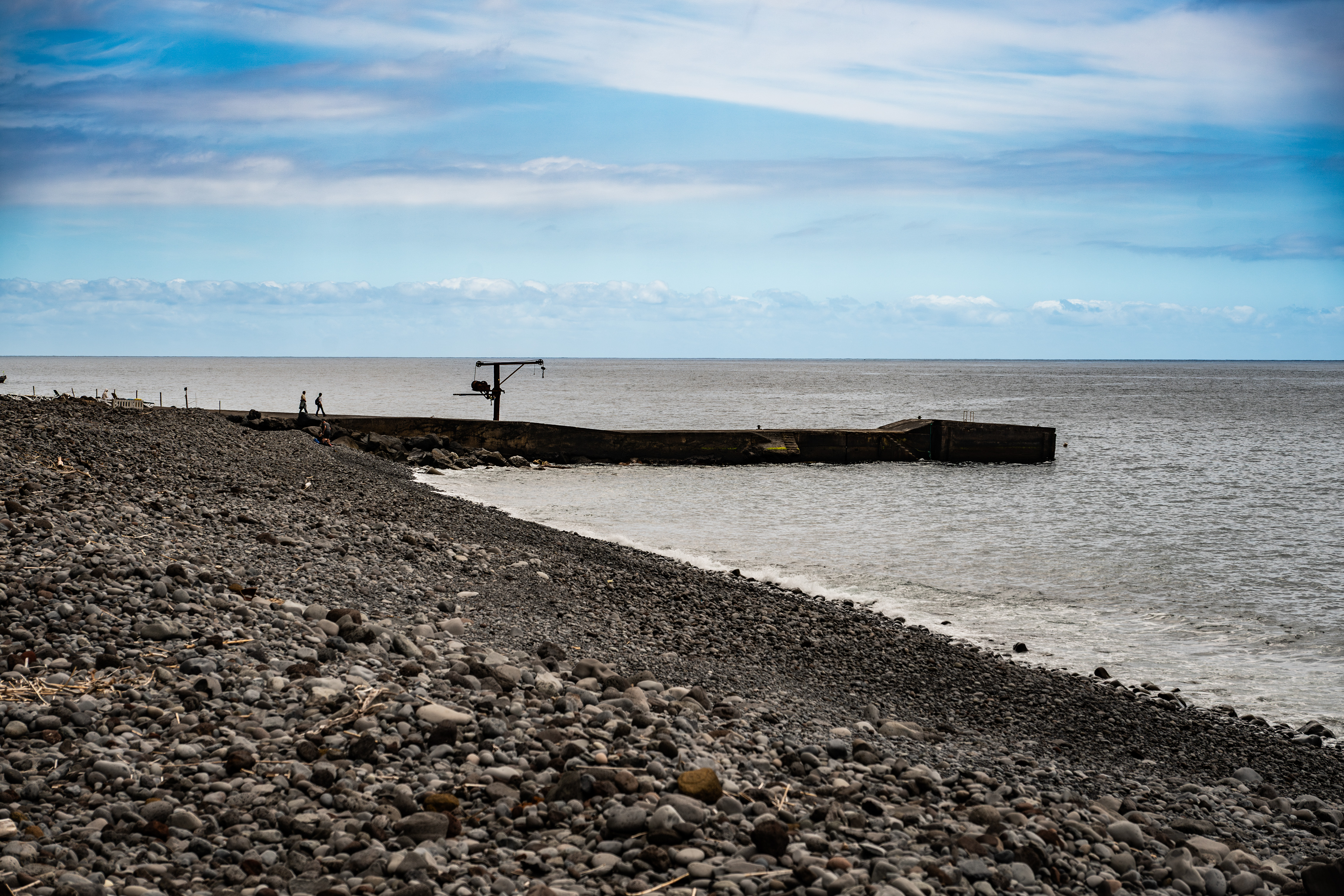 a small pier extending into the sea