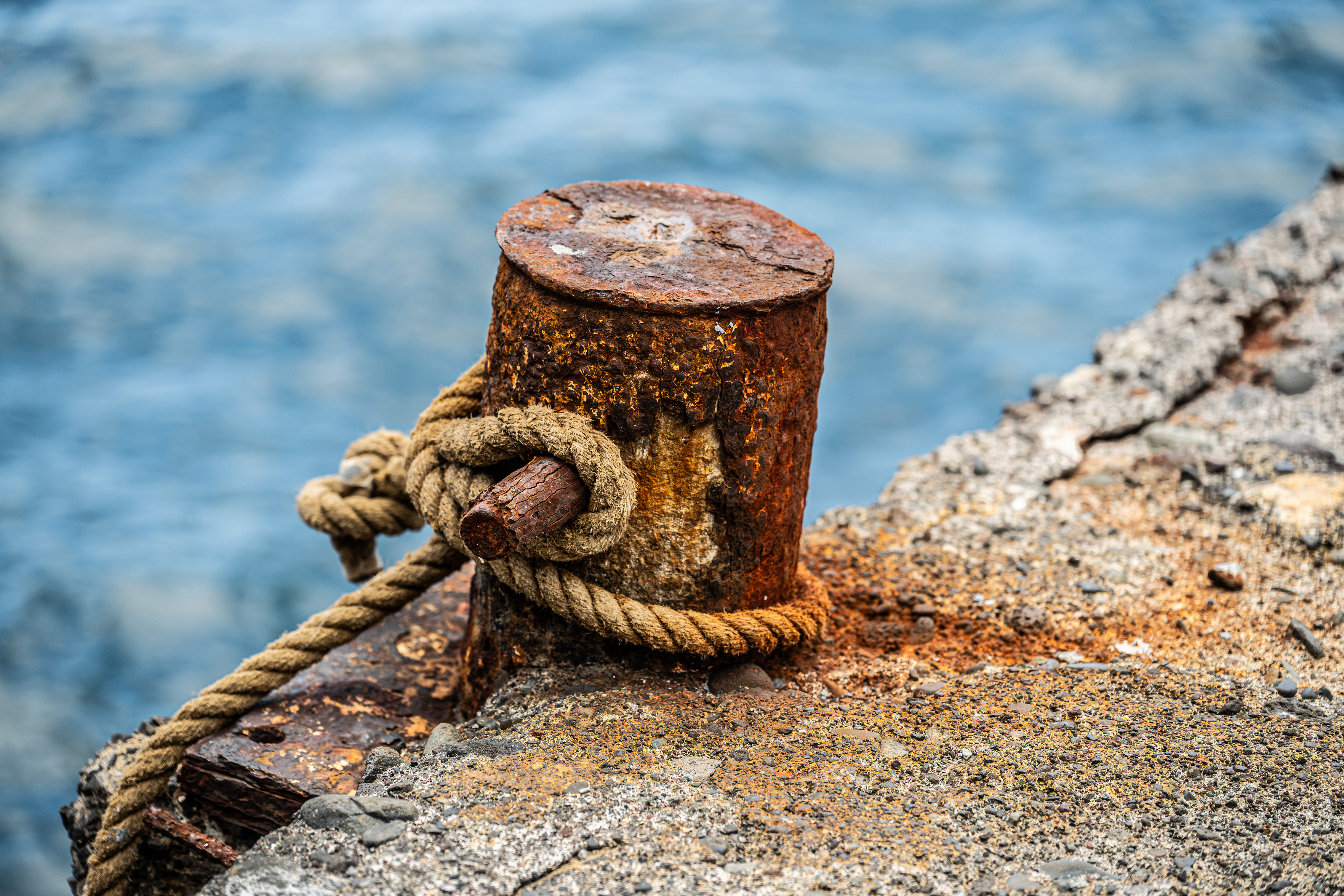 rusted metal bollard