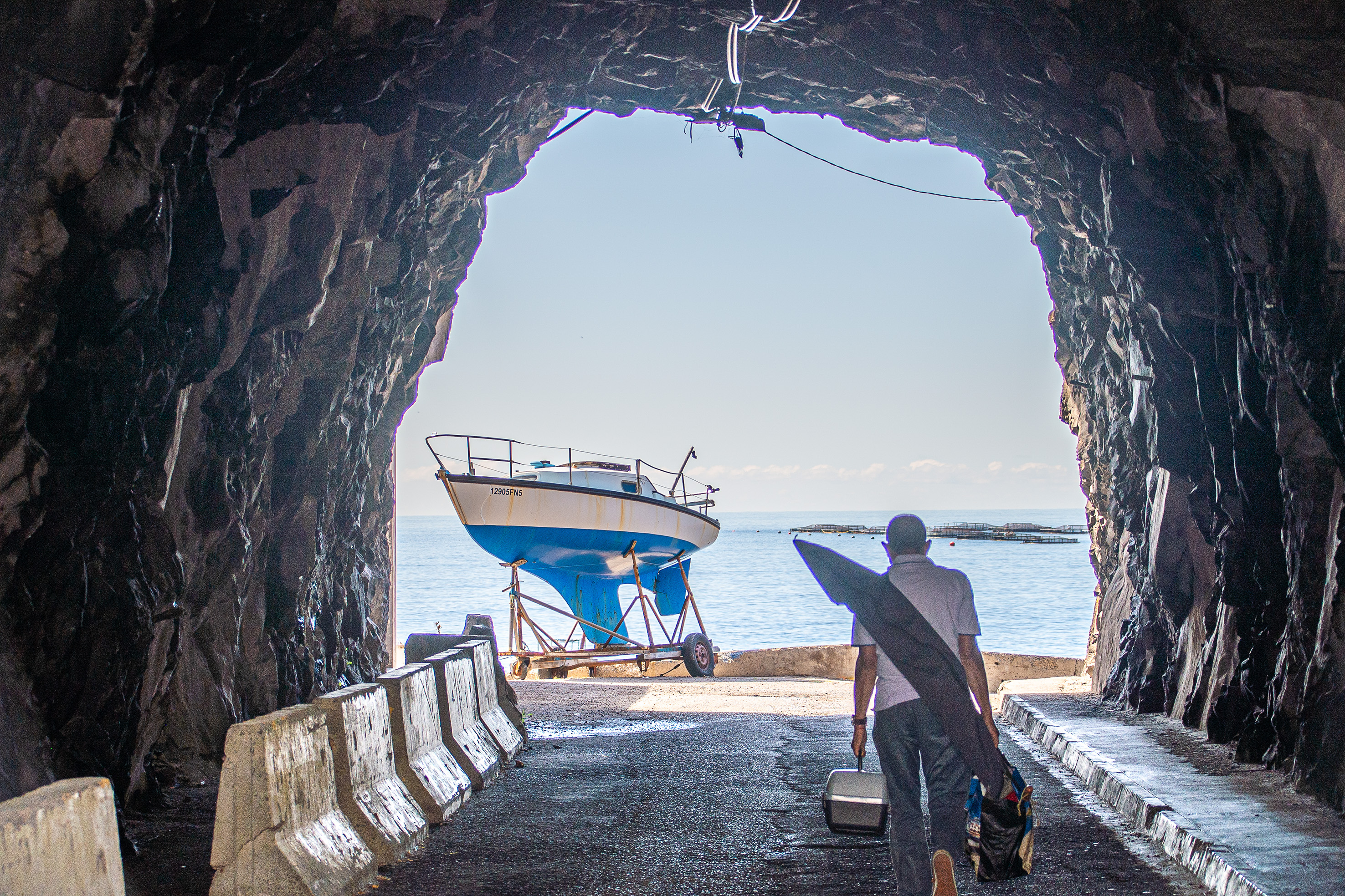 A person is seen exiting a cave