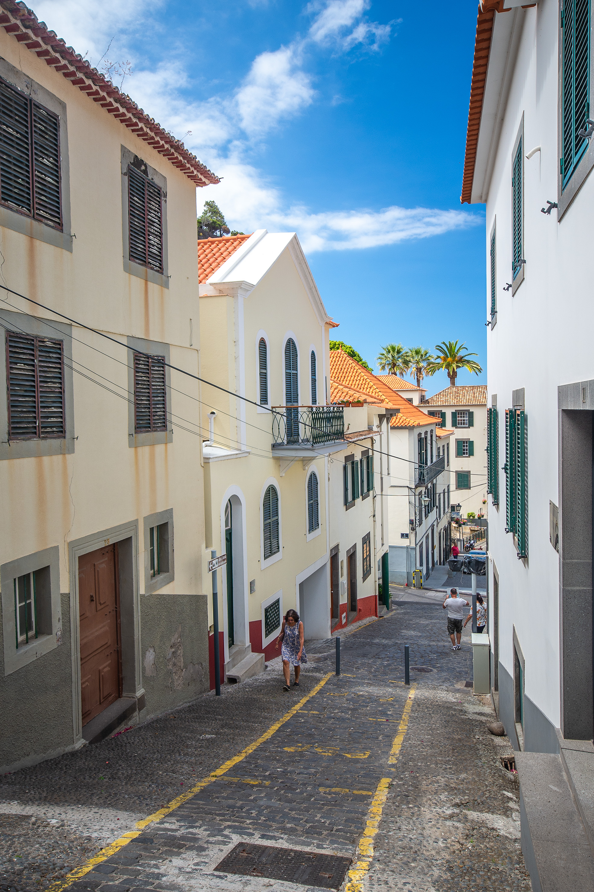 a narrow, cobblestone street