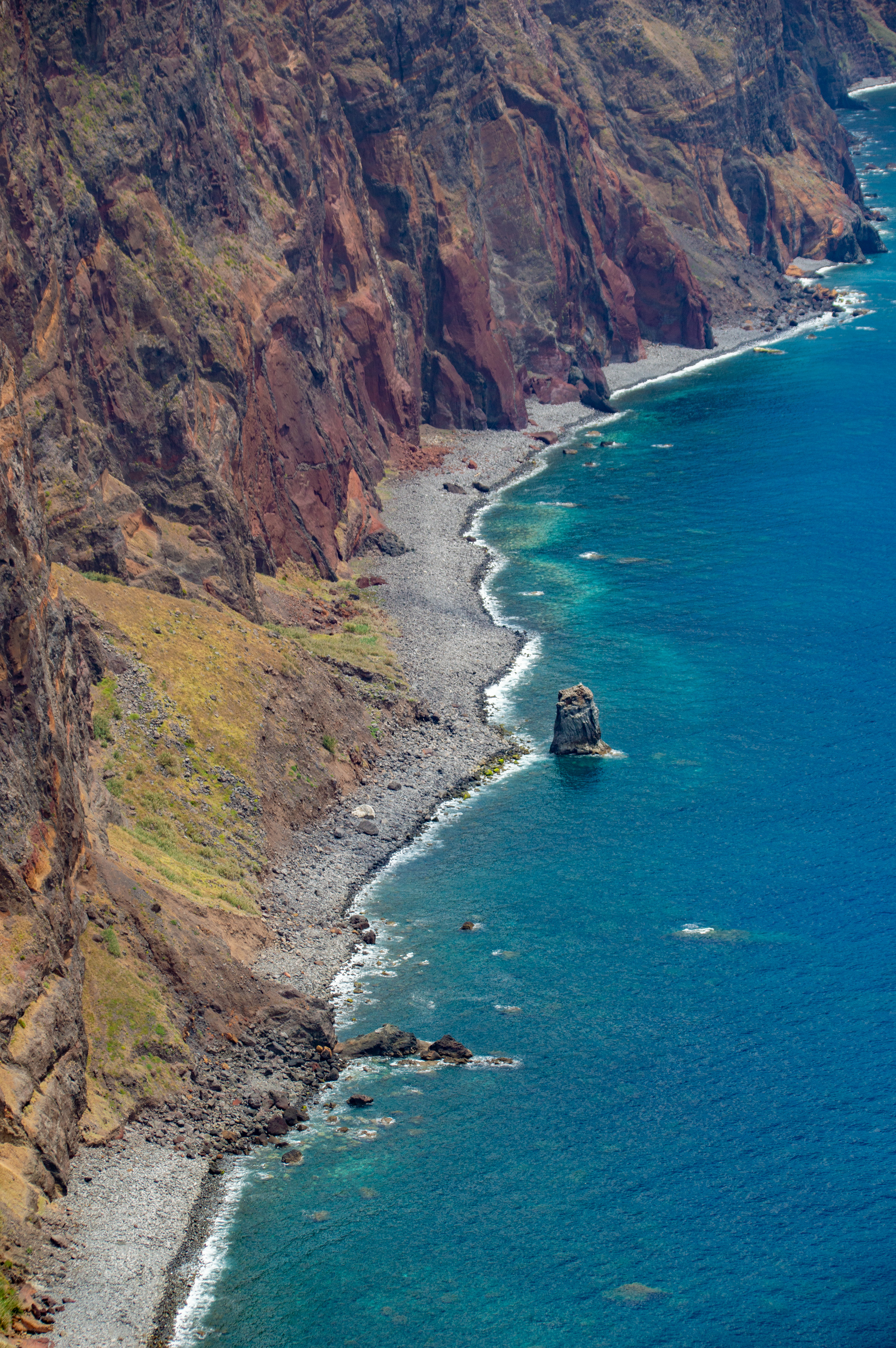 isolated rock formation in the turquoise sea