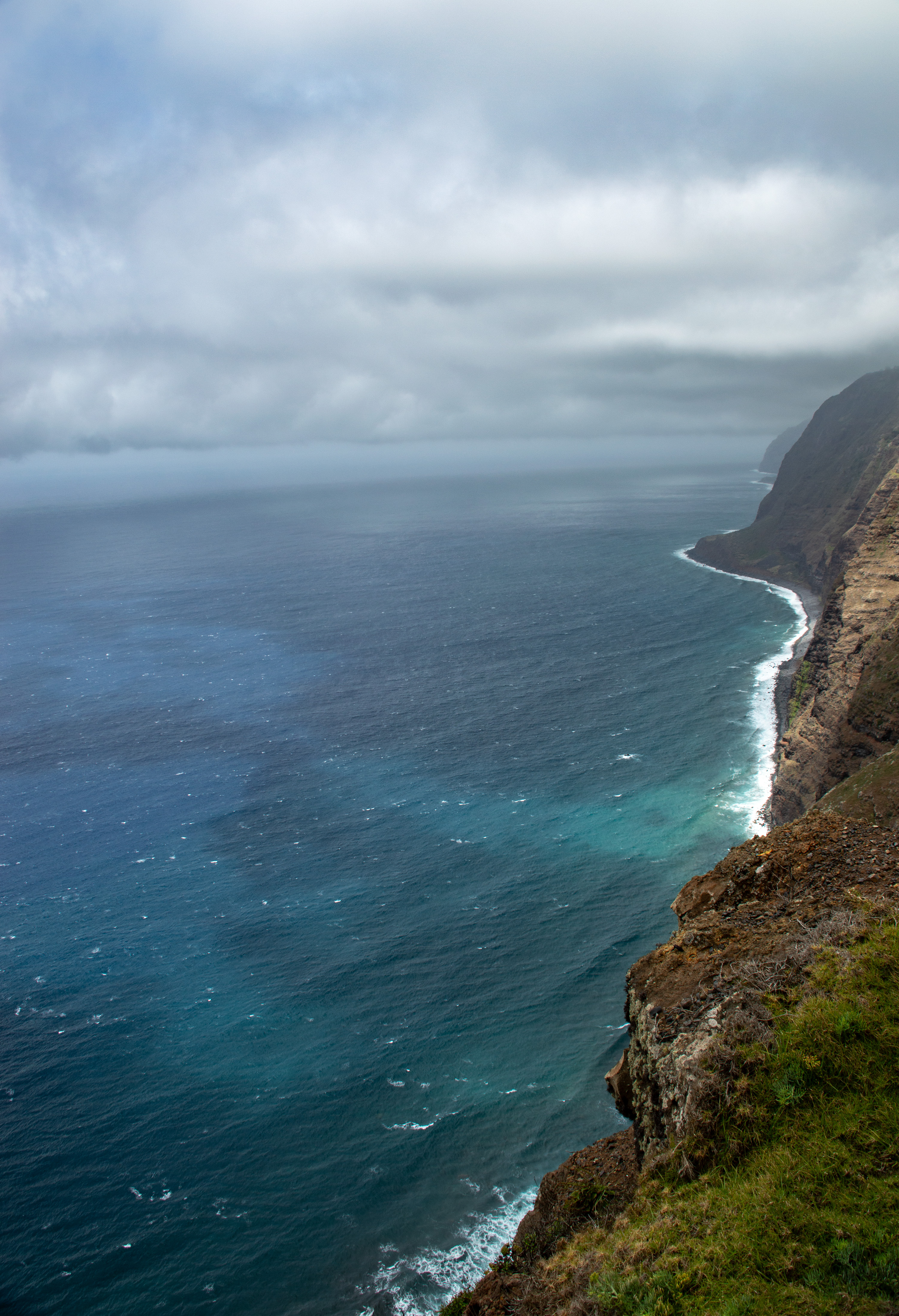 The sky is overcast with dark, heavy clouds