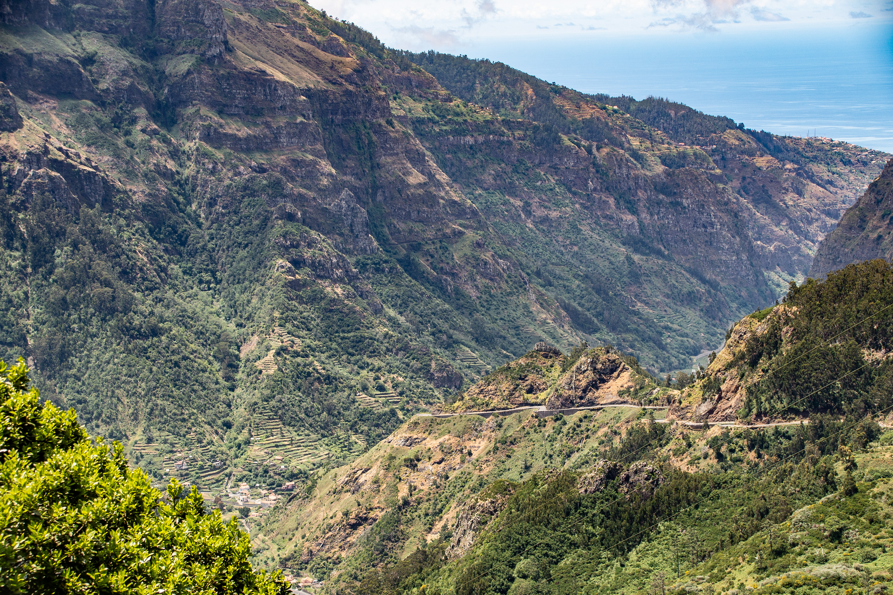 mountainous landscape with lush greenery, terraced hillsides