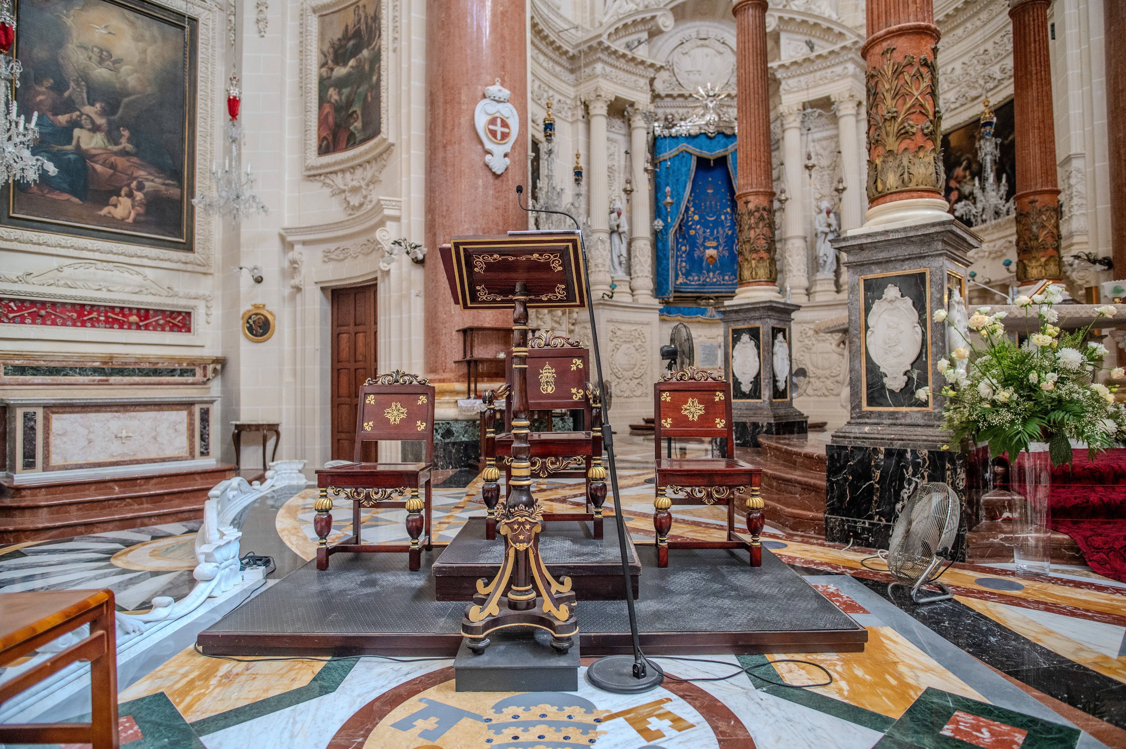 The pulpit is elevated on a platform with steps leading up to it