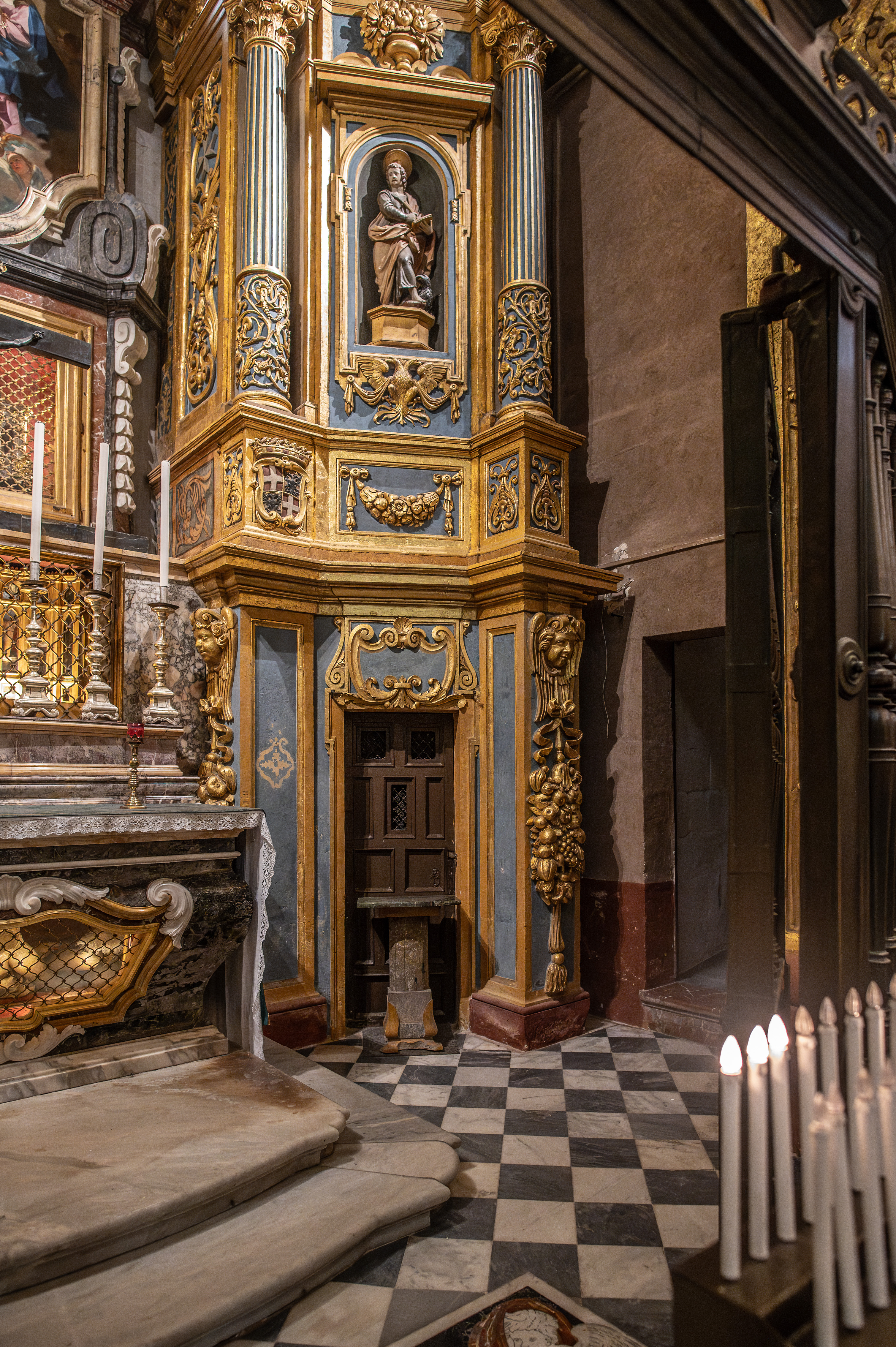 a richly decorated altar with intricate gold and blue detailing