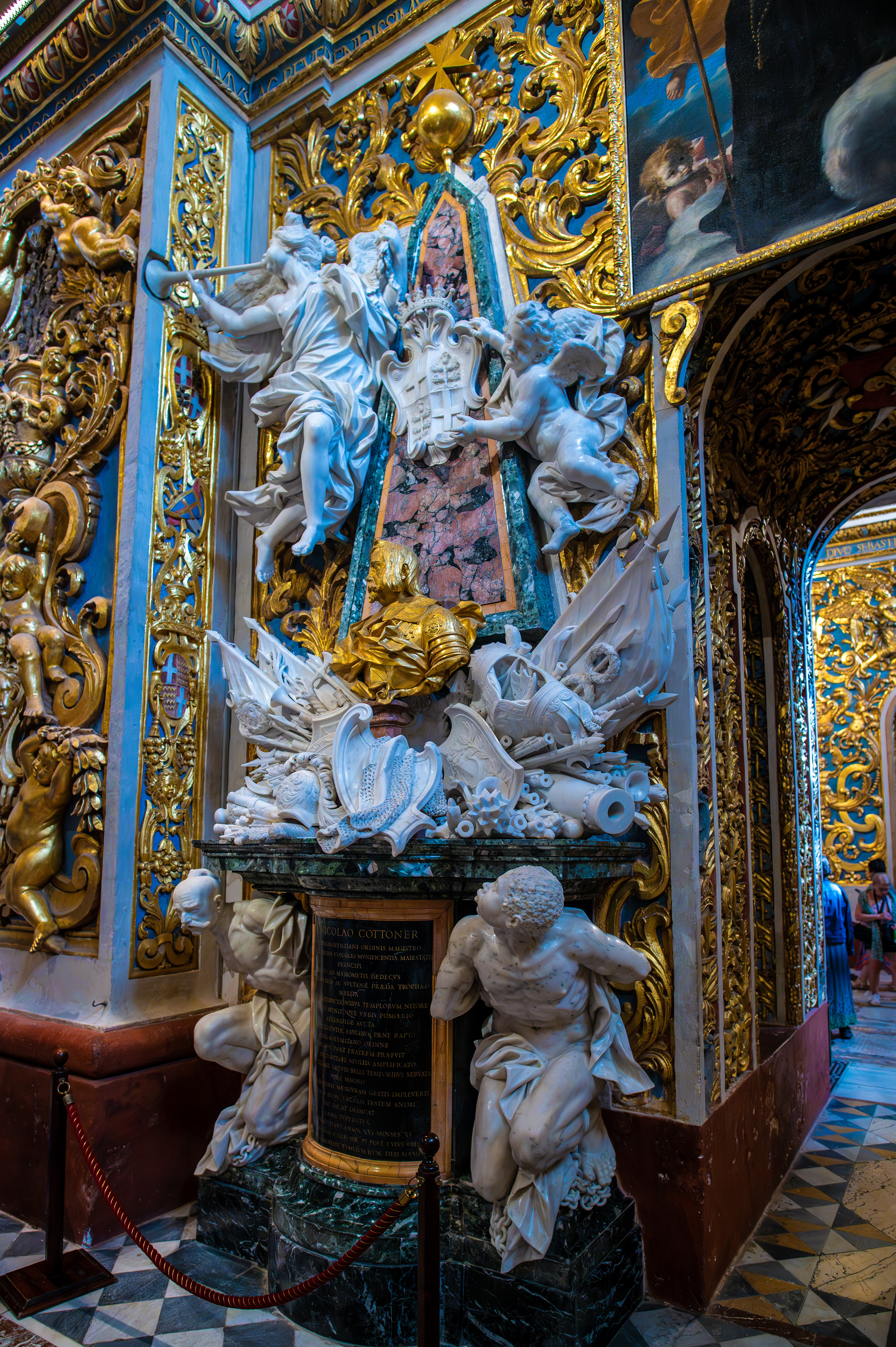 baroque-style monument with intricate sculptures and gold detailing