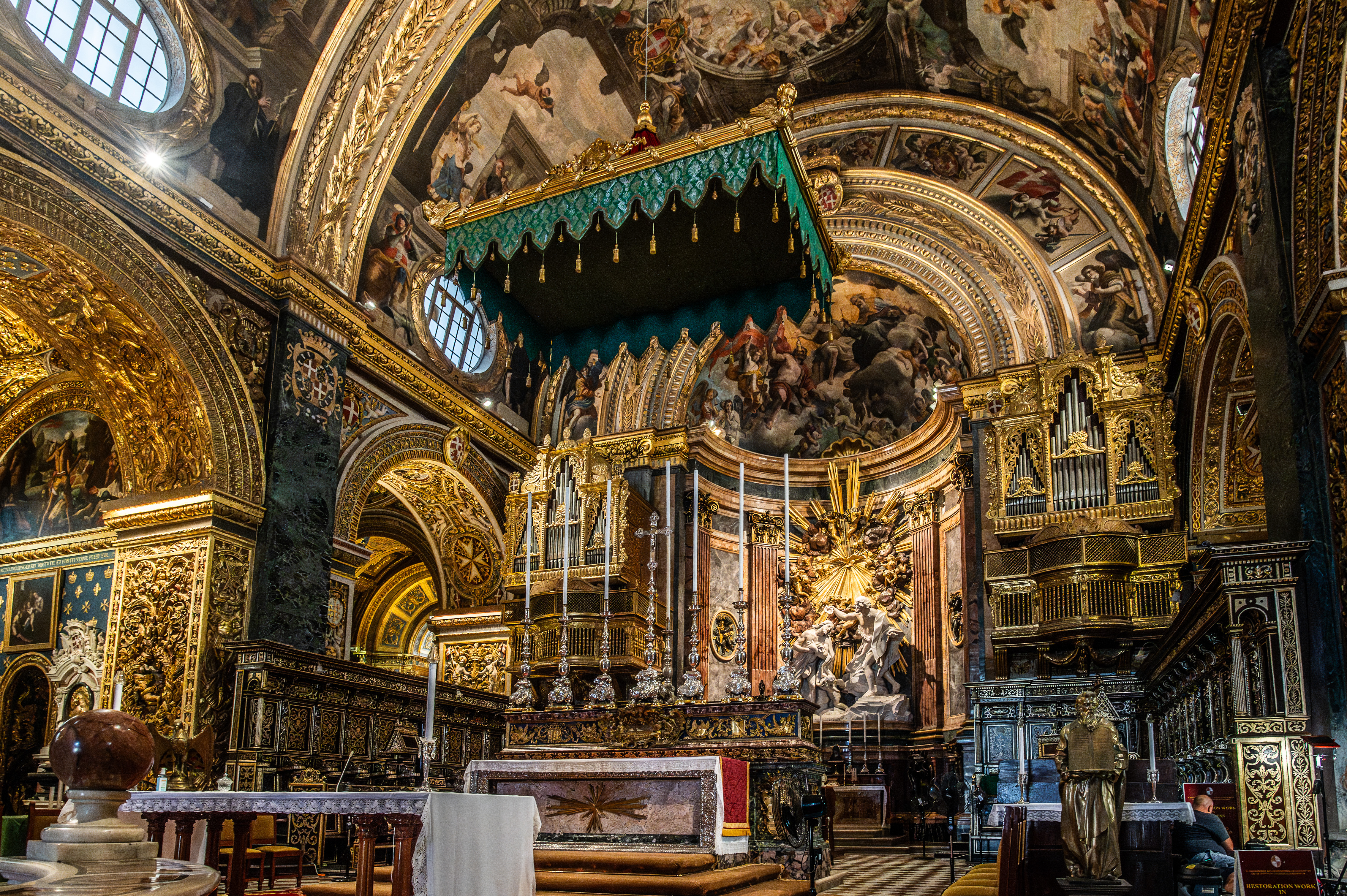 The altar is centrally positioned and adorned with statues