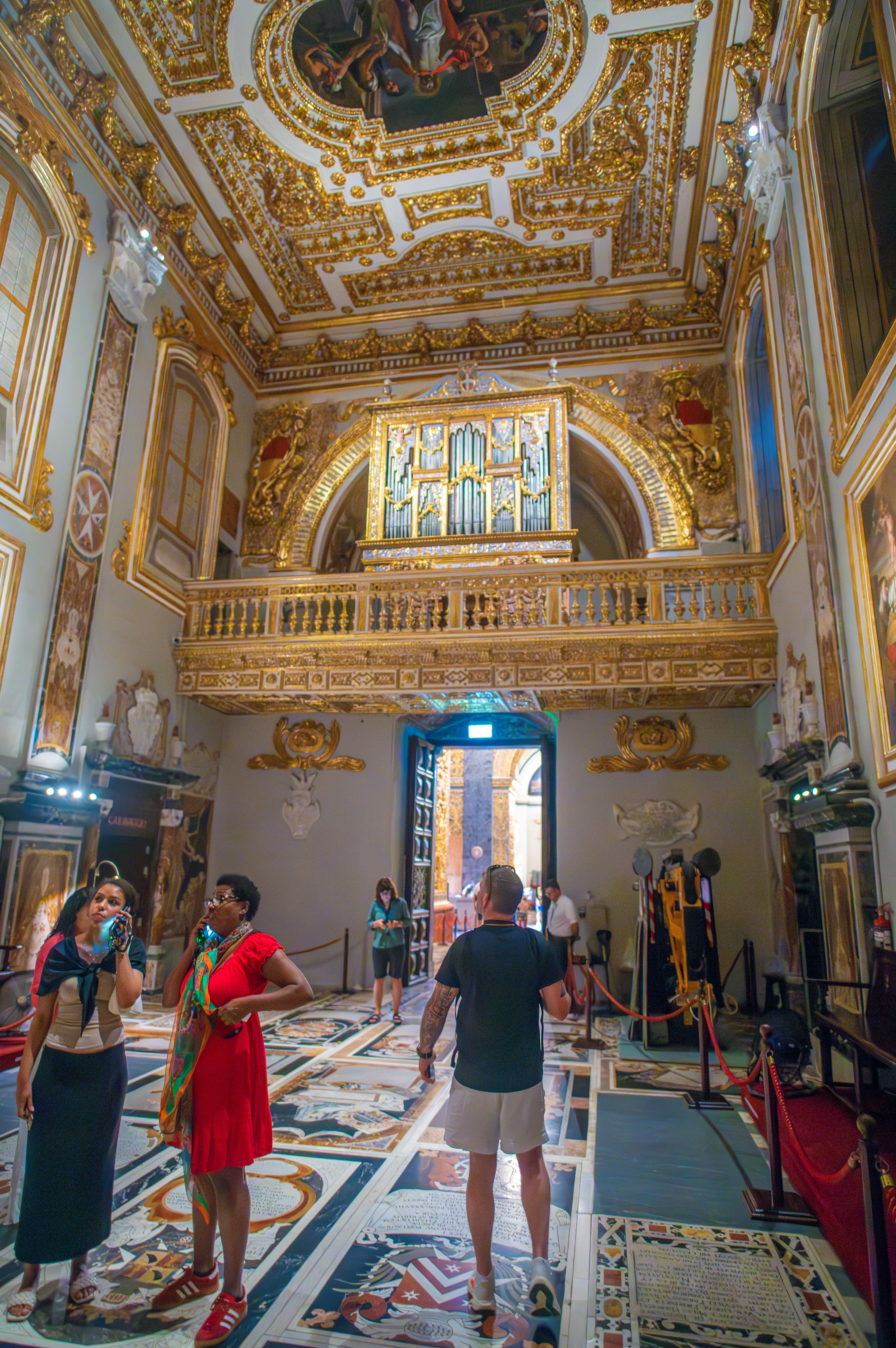 The ceiling and walls are richly decorated with gold accents