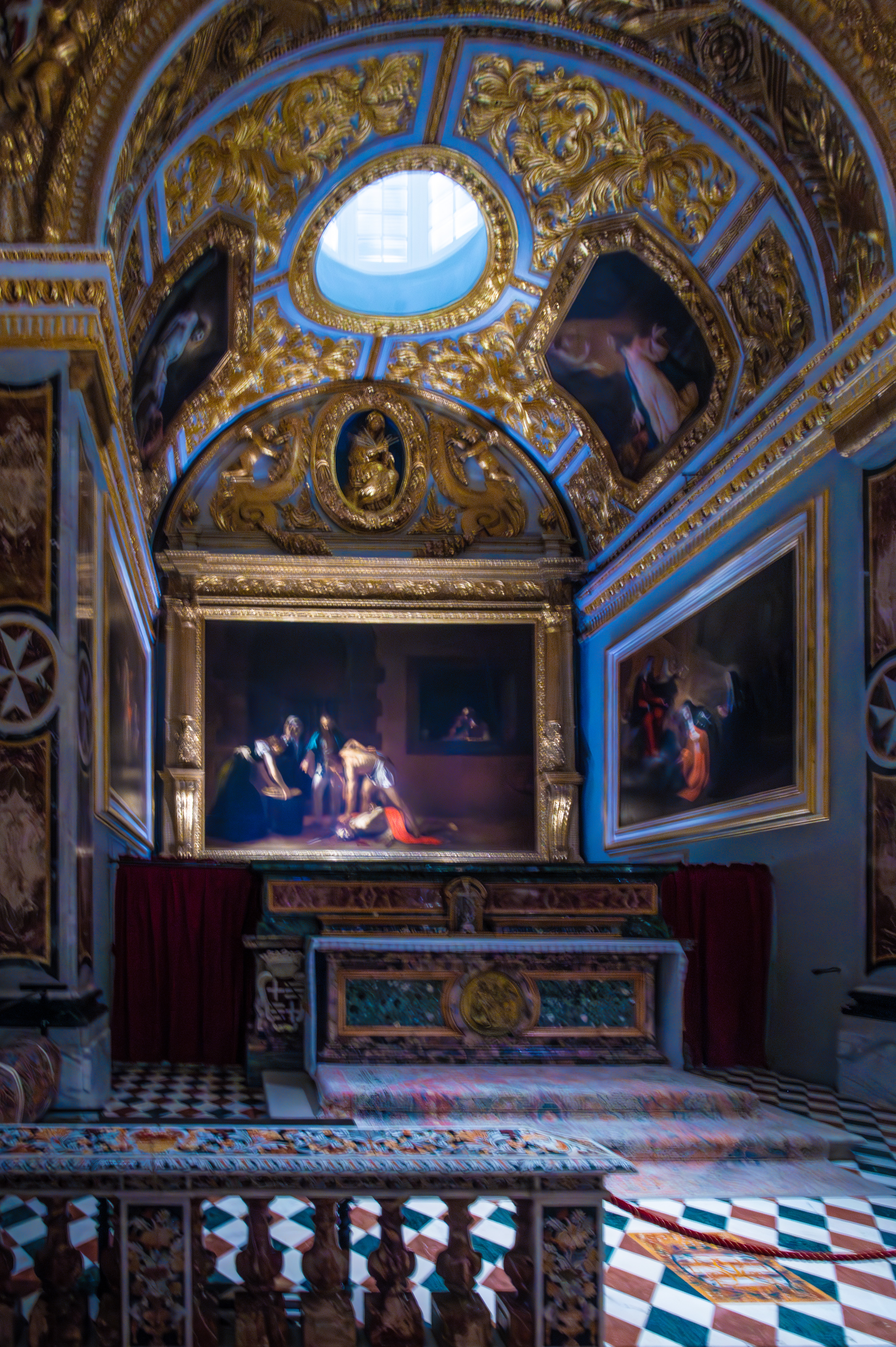 a central oval window that allows natural light to illuminate the space