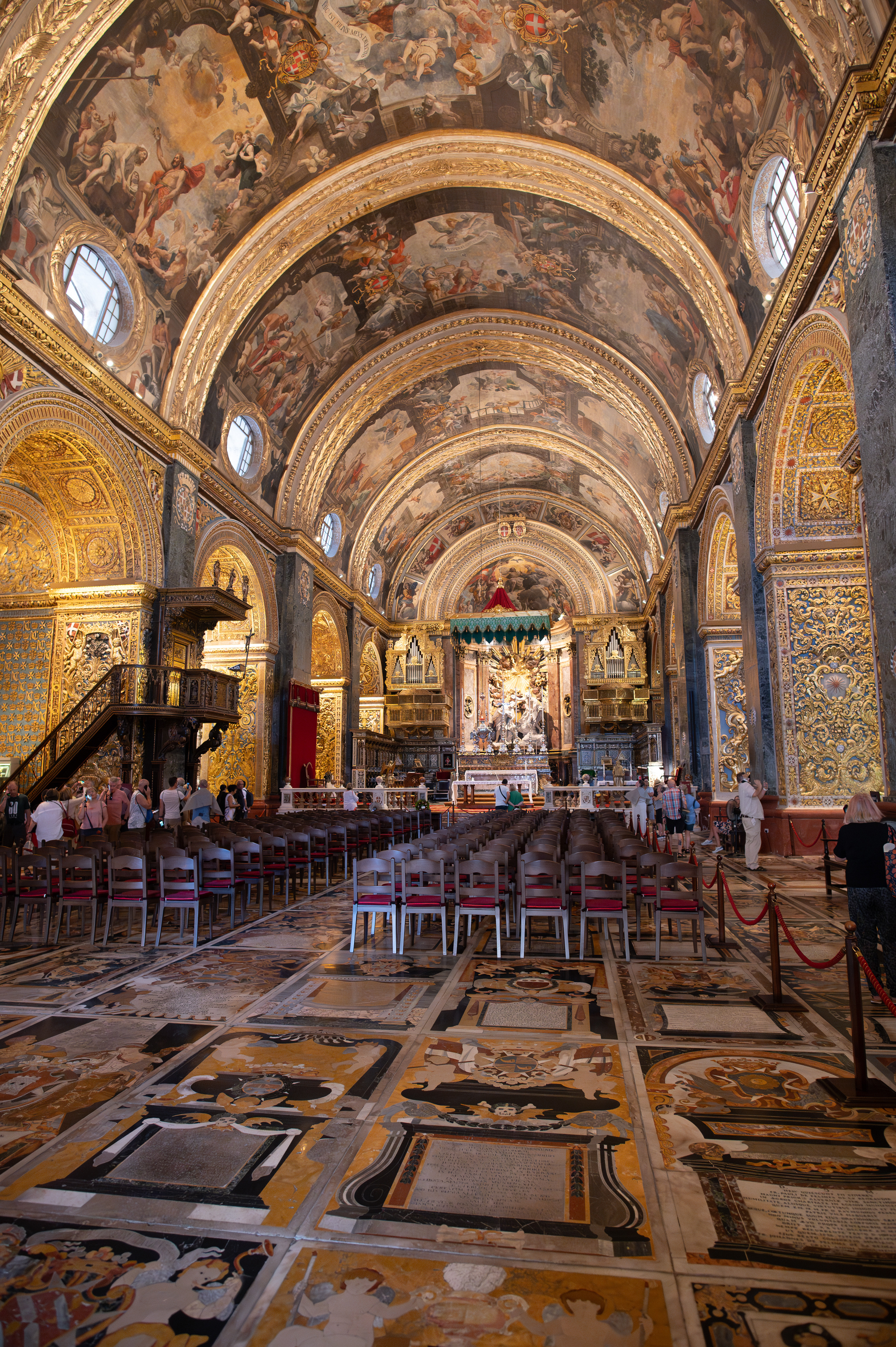 The floor features elaborate marble inlays