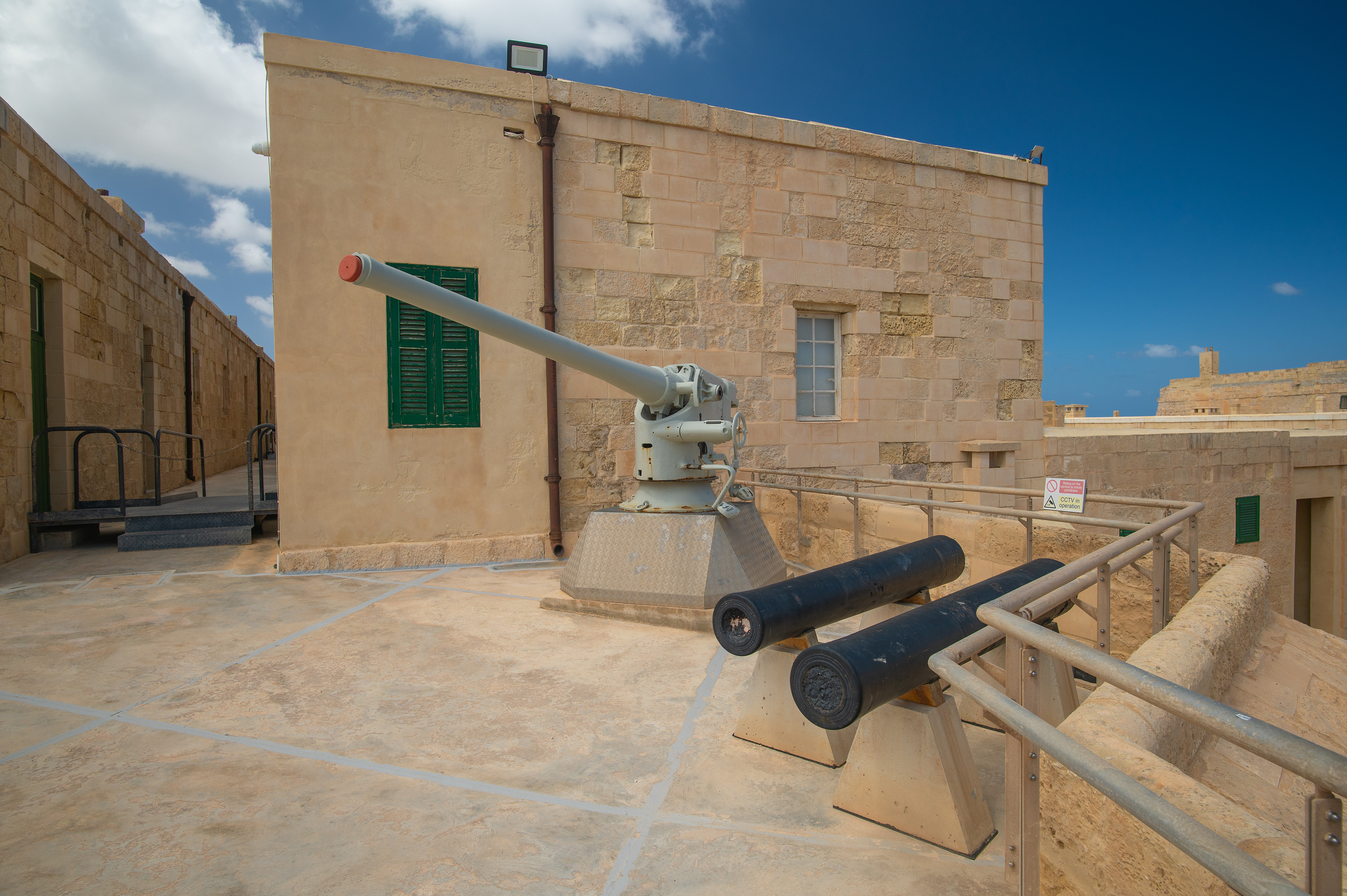 two cannons and an anti-aircraft gun