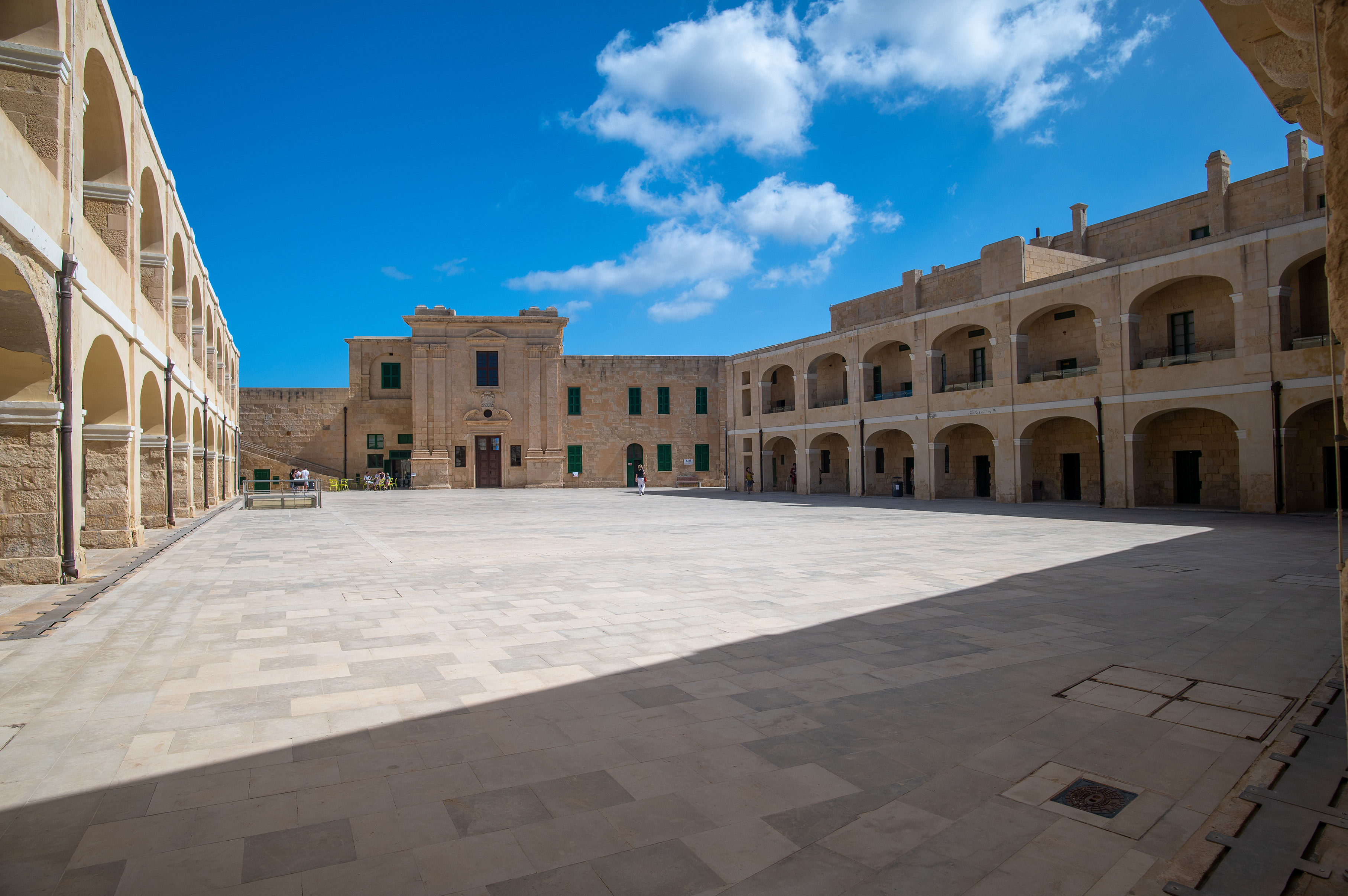 stone buildings with arched colonnades