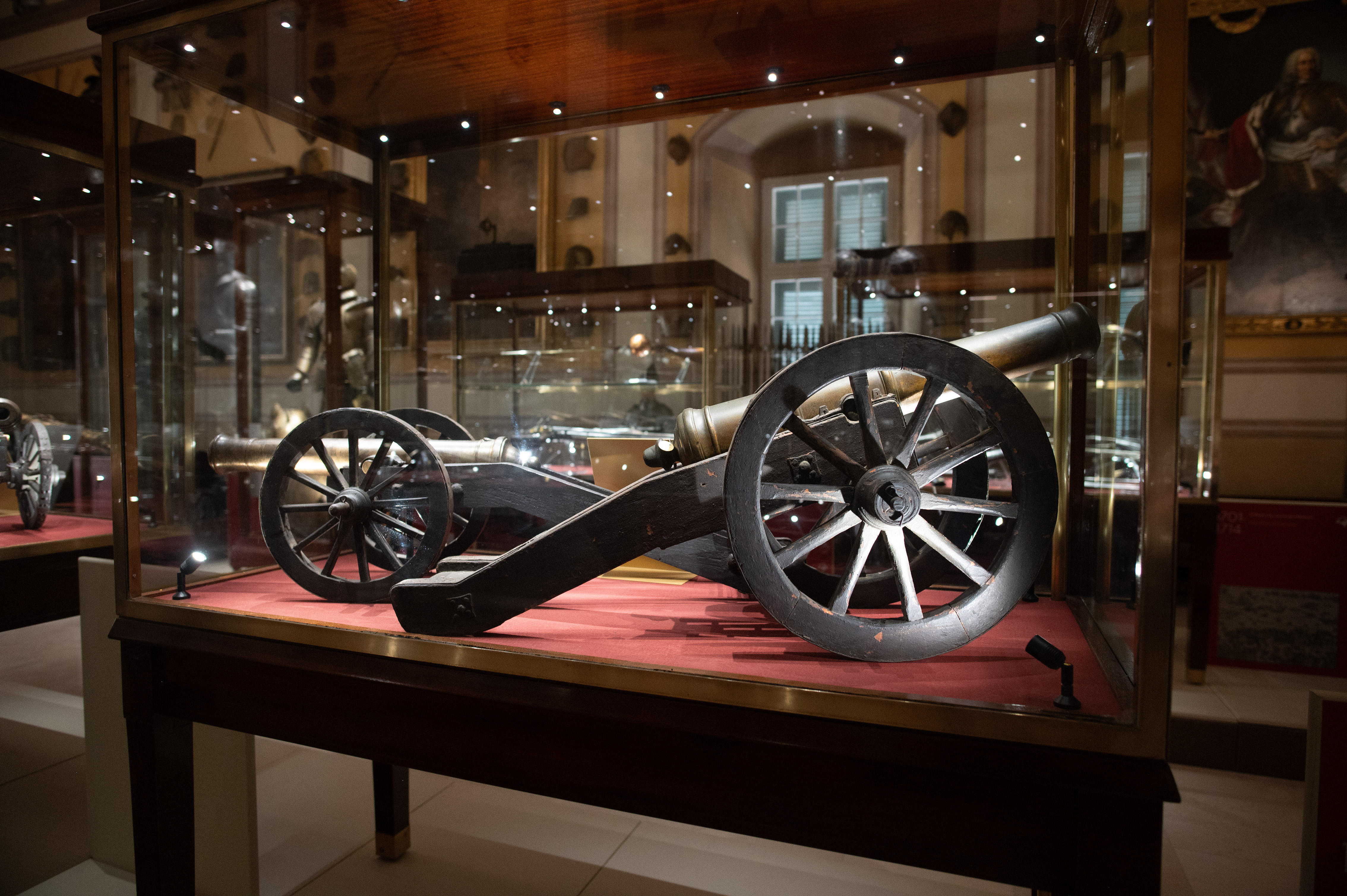 Cannon, mounted on a wooden carriage with large spoked wheels