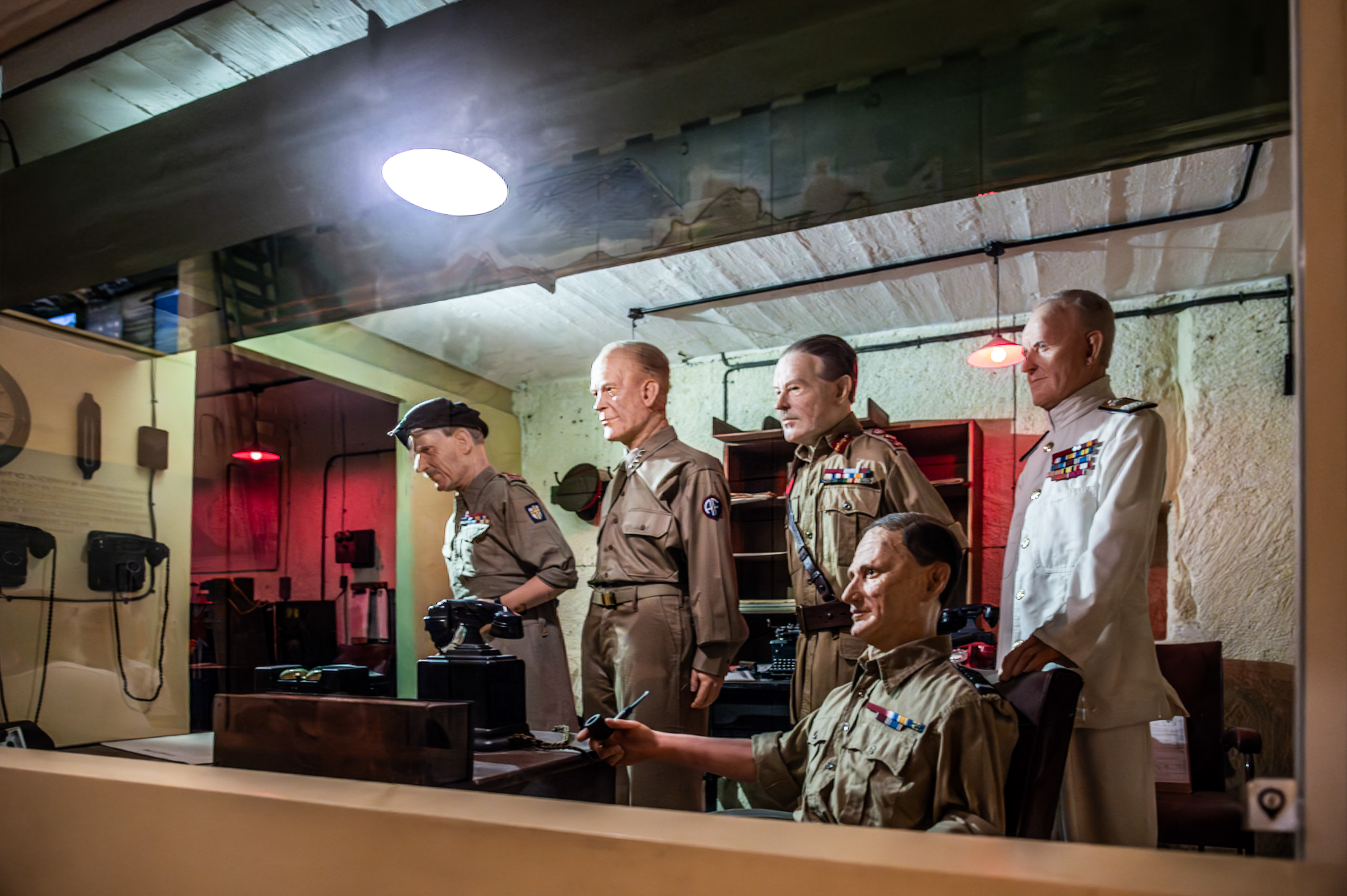 wax figures of military personnel in a wartime command center