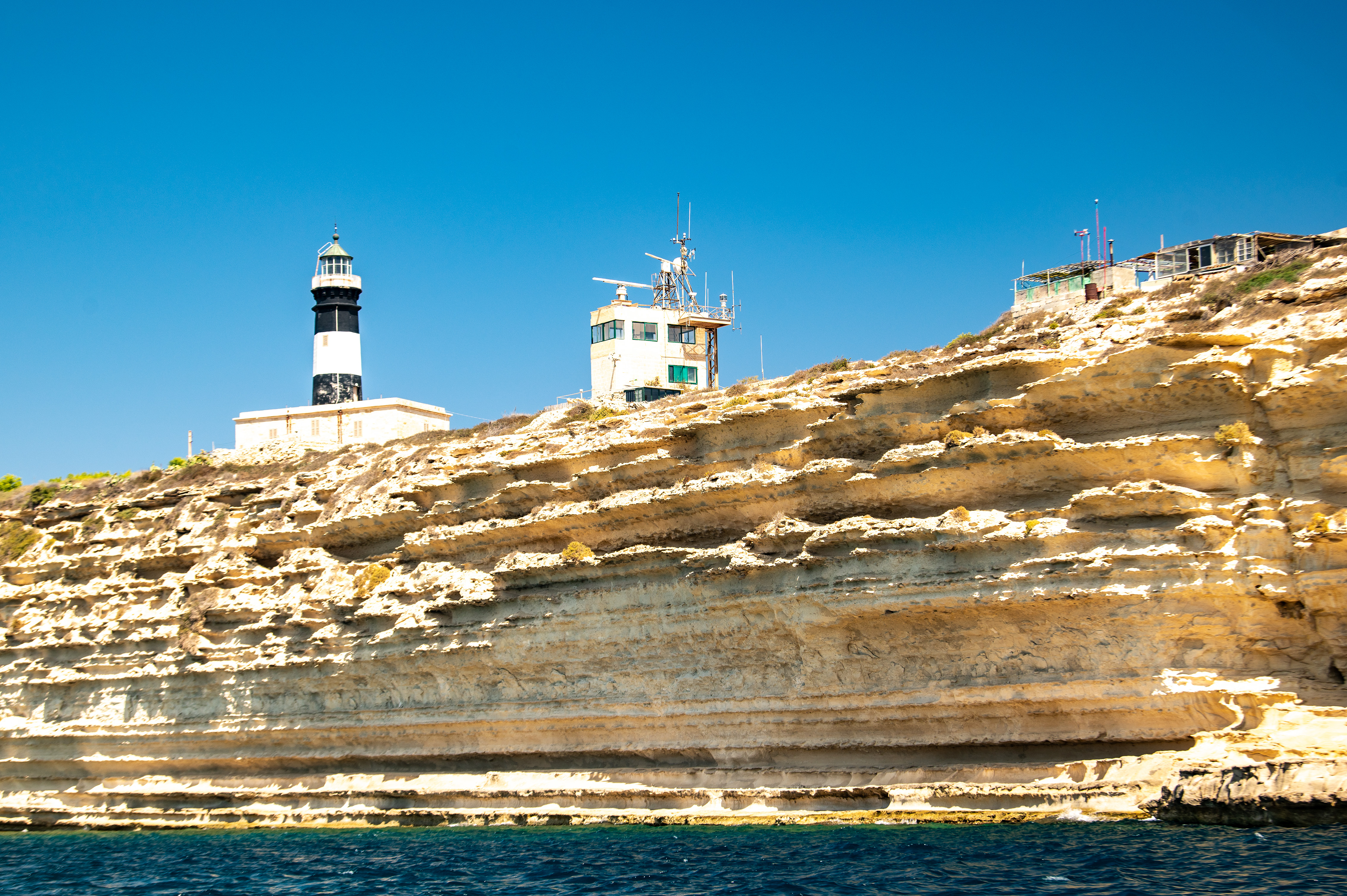 a lighthouse and a control tower